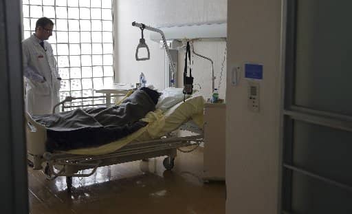A doctor visits a patient in the palliative care unit of a hospital in Paris March 4, 2015. In a document issued Jan. 20, 2022, (CNS photo/Philippe Wojazer, Reuters.)