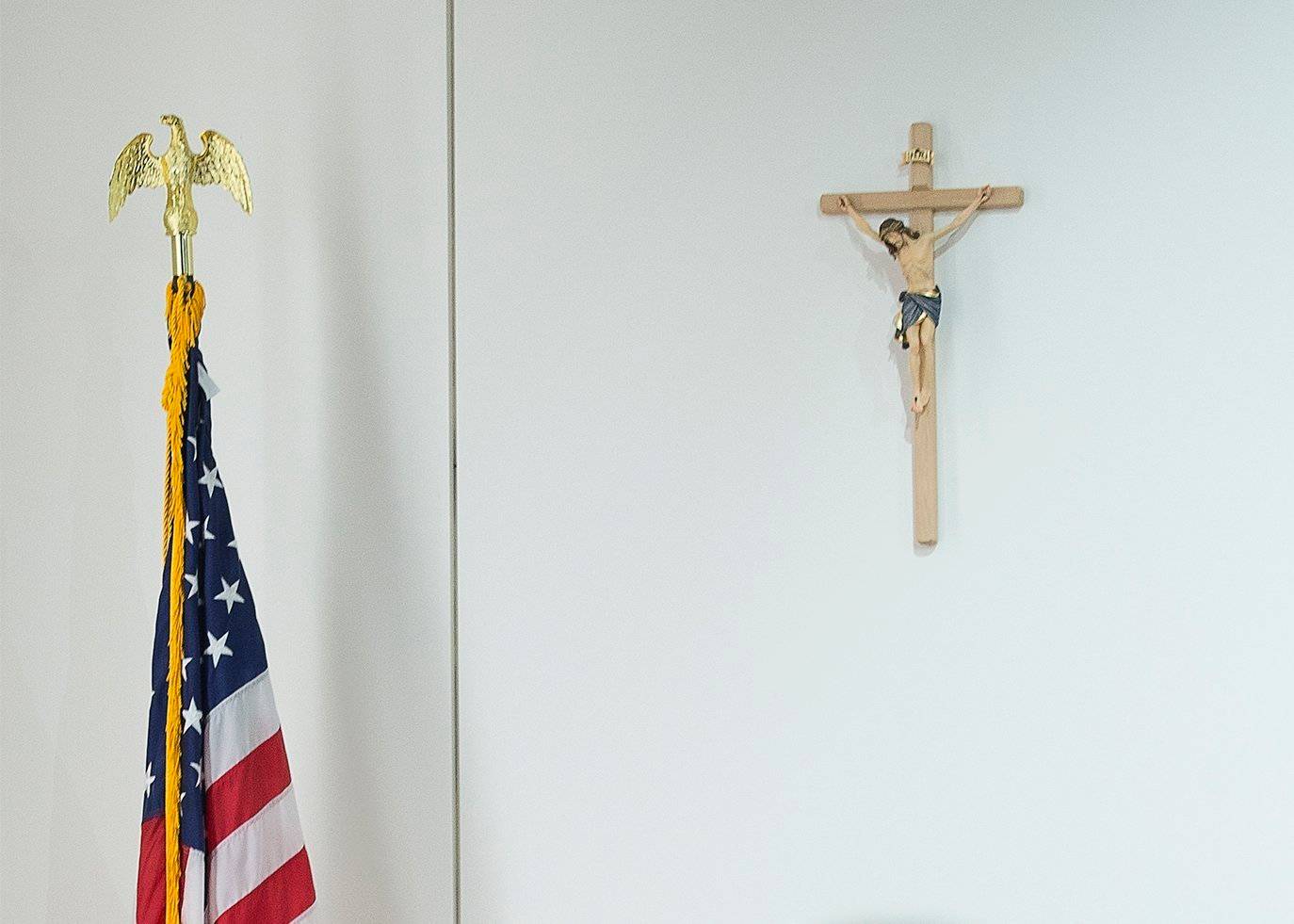 A cross and a U.S. flag are seen in this undated photo. (Credit: Tyler Orsburn/CNS.)