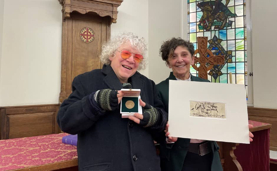 Michael McVeigh with his gift from Pope Francis and Rt Rev Sally Foster-Fulton holds a print of 'Throwaway People'. (Credit: Church of Scotland.)
