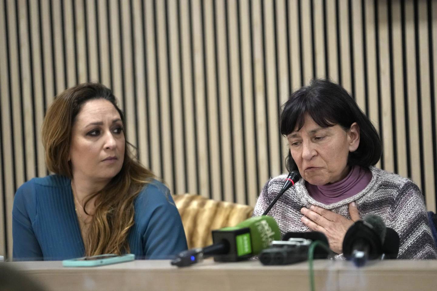 Lawyer Laura Sgro, left, listens to Gloria Branciani during a press conference in Rome on Wednesday, Feb. 21, 2024. Gloria Branciani is one of the first women who accused Fr. Marko Rupnik, a once-exalted Jesuit artist of spiritual, psychological and sexual abuse. (Credit: Alessandra Tarantino/AP.)