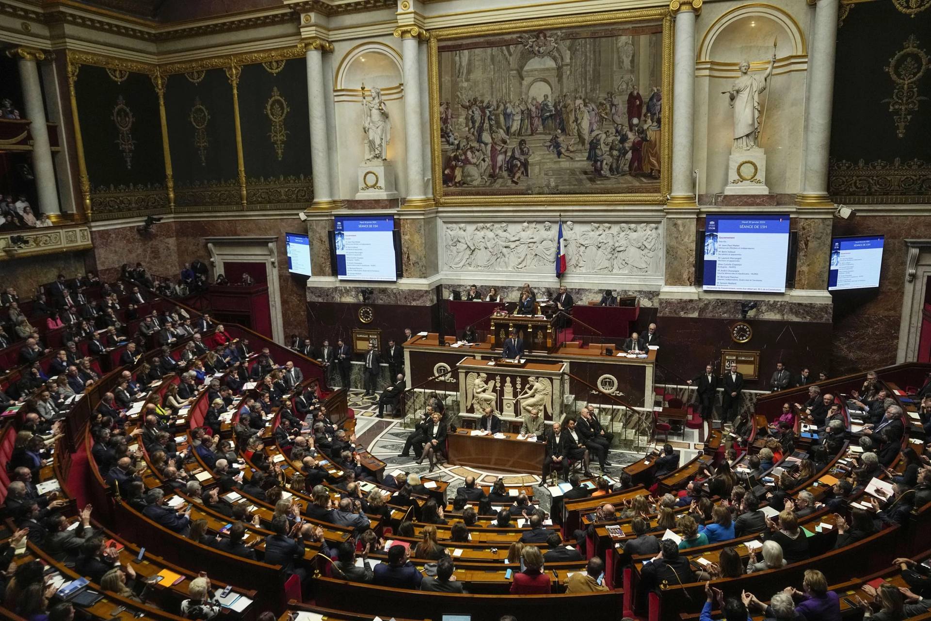 Lawmakers gather at the National Assembly on Tuesday, Jan. 30, 2024, in Paris. (Credit: Michel Euler/AP.)