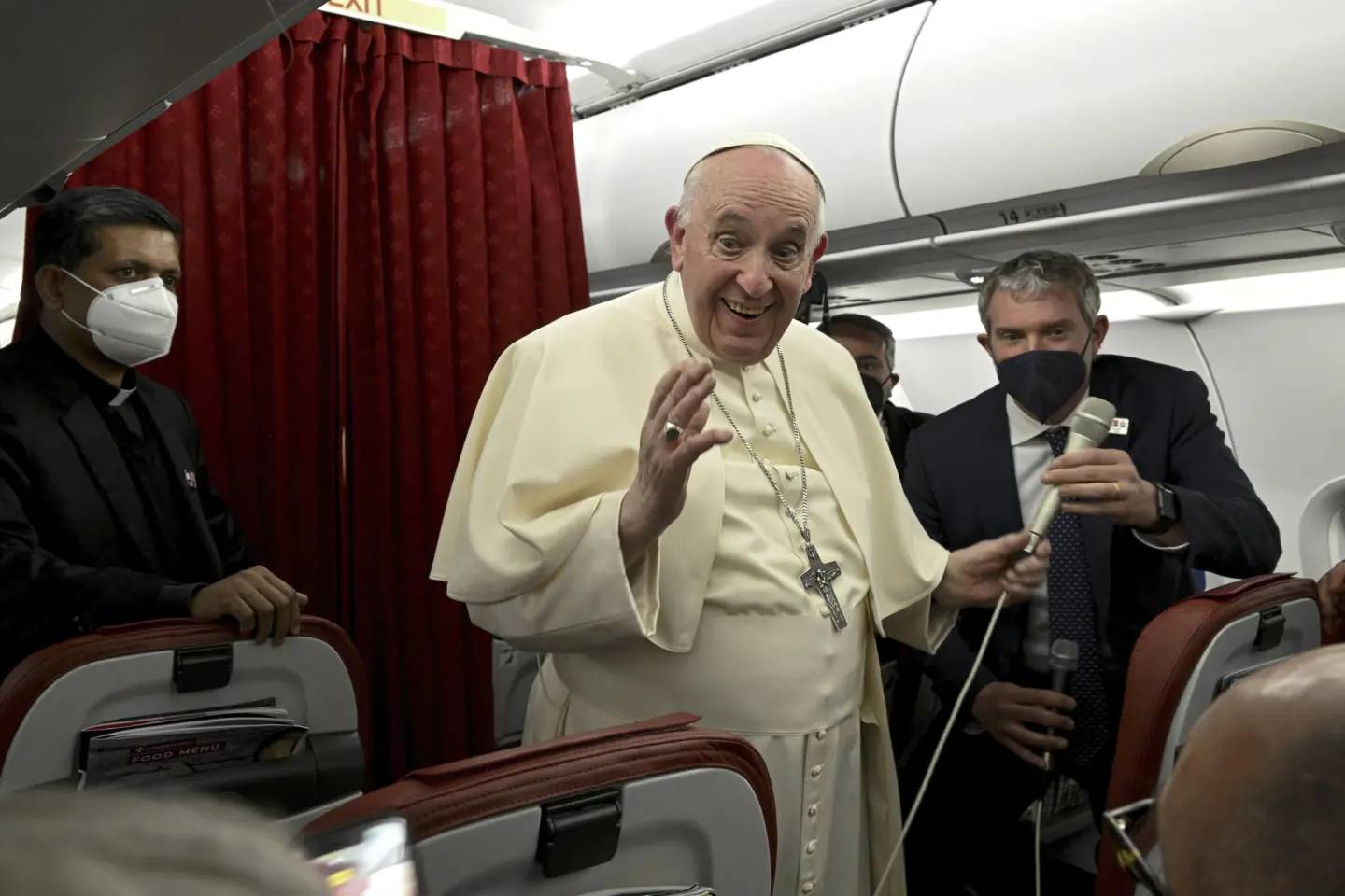 Pope Francis greets the journalists onboard the papal plane during the flight back to Rome at the end of his two-day apostolic visit to Malta, Sunday, April 3, 2022. (Credit: Ciro Fusco /Pool photo via AP.)