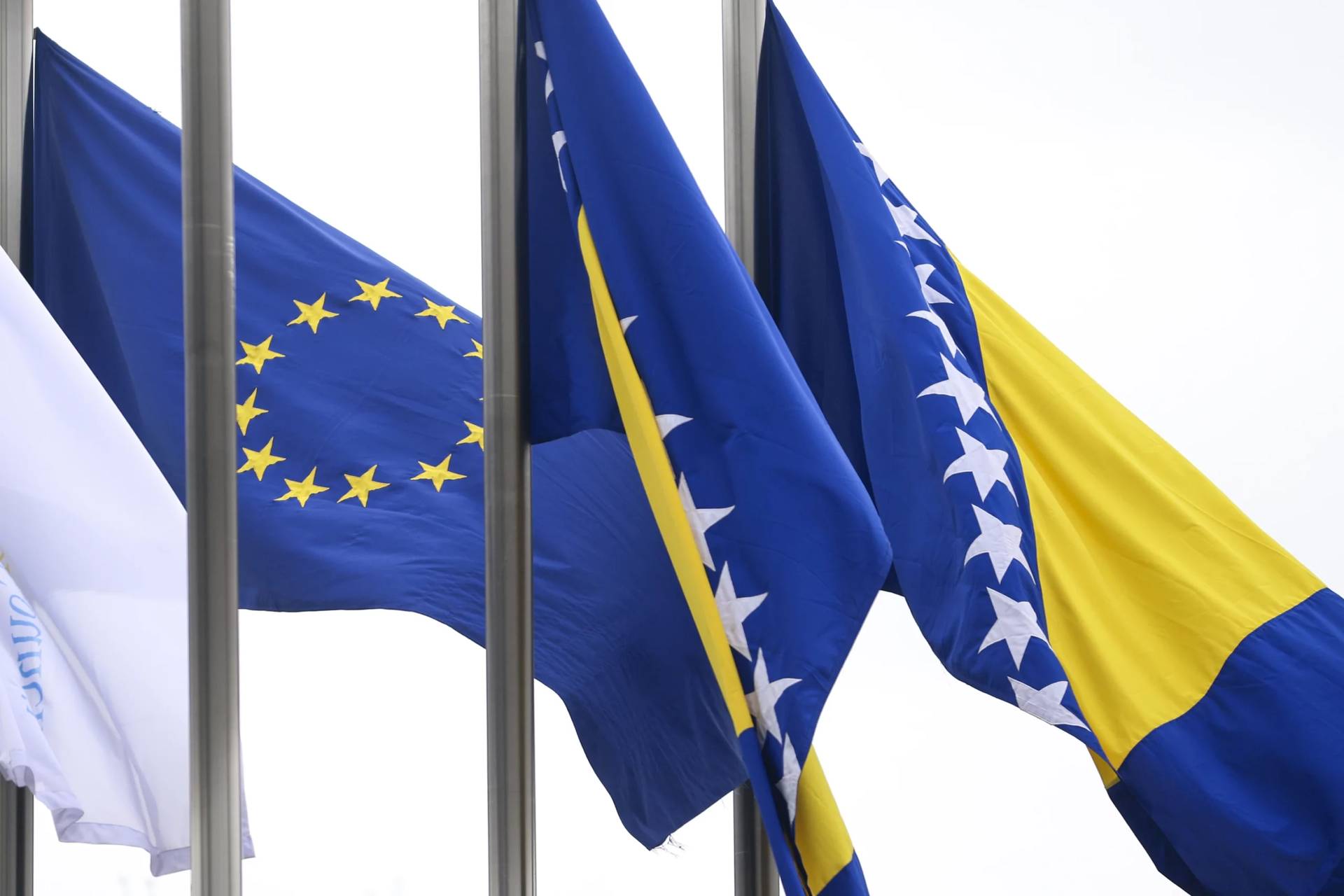 European Union flag is next to the flag of Bosnia and Herzegovina in Sarajevo, March 12, 2024. (Credit: Armin Durgut/AP.)