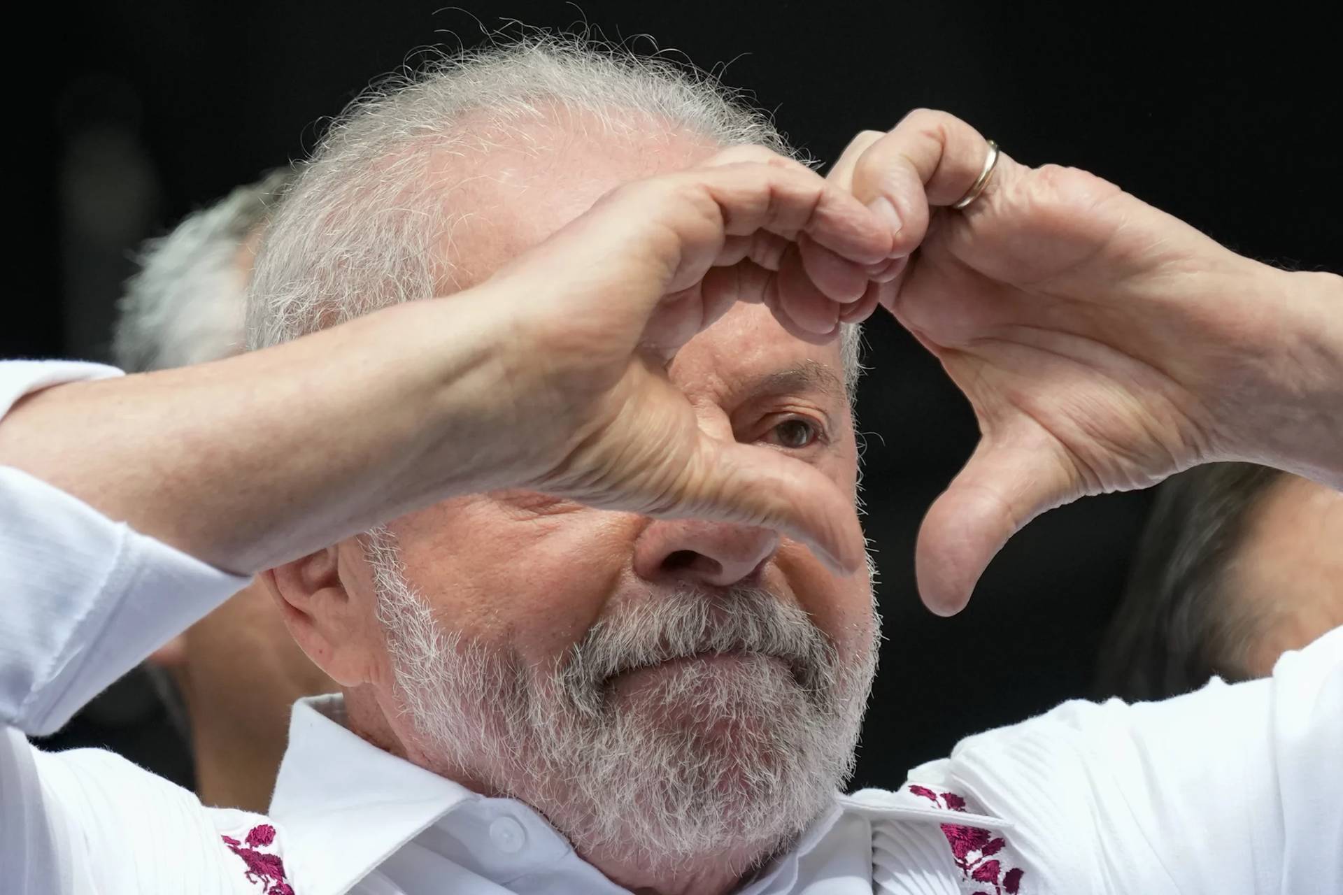Brazilian President Luiz Inacio Lula da Silva flashes a heart-hand sign at supporters during a rally in Sao Paulo, Brazil, May 1, 2023. (Credit: Andre Penner/AP.)
