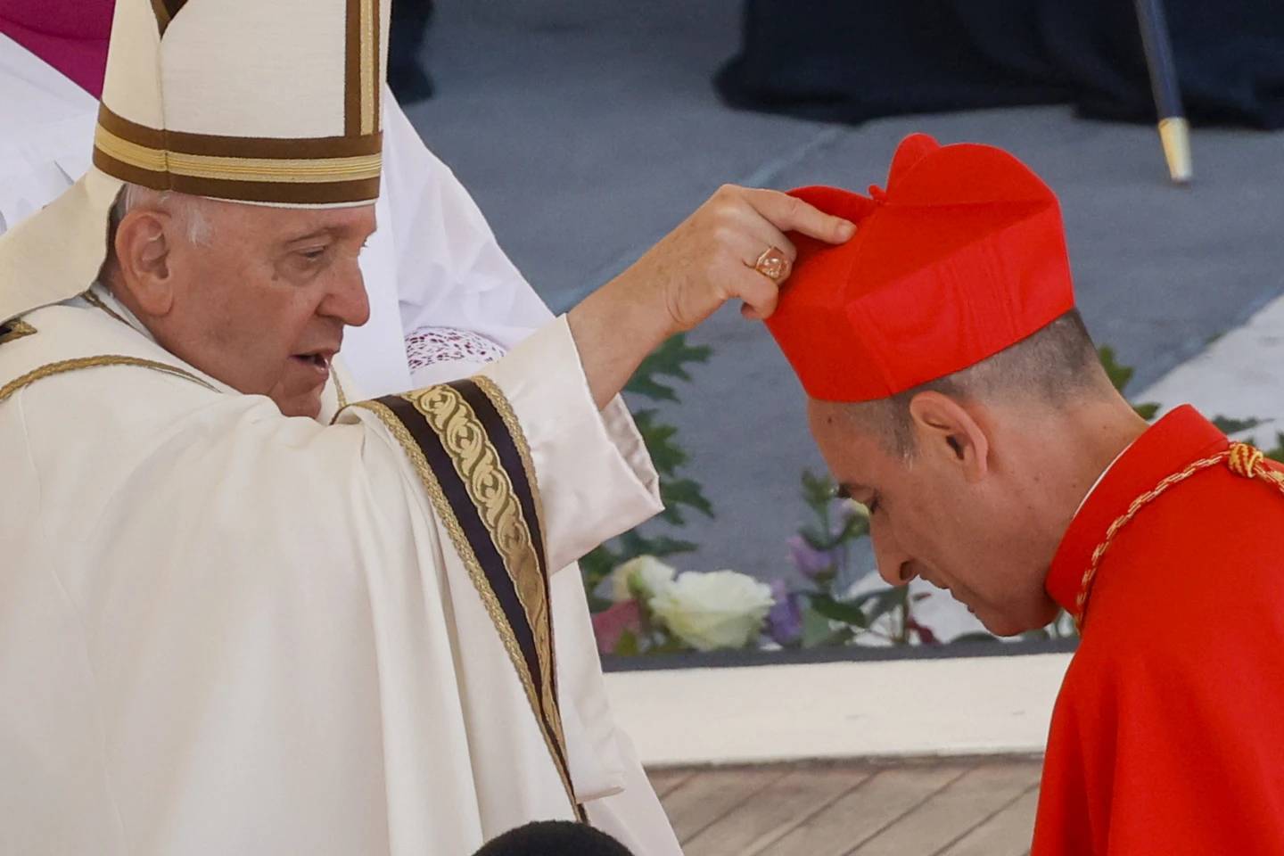 Cardinal Victor Manuel Fernandez, prefect of the Dicastery for the Doctrine of the Faith, right, receives his red biretta from Pope Francis as he is elevated in St. Peter's Square at the Vatican on Saturday, Sept. 20, 2023. (Credit: Riccardo De Luca/AP.)
