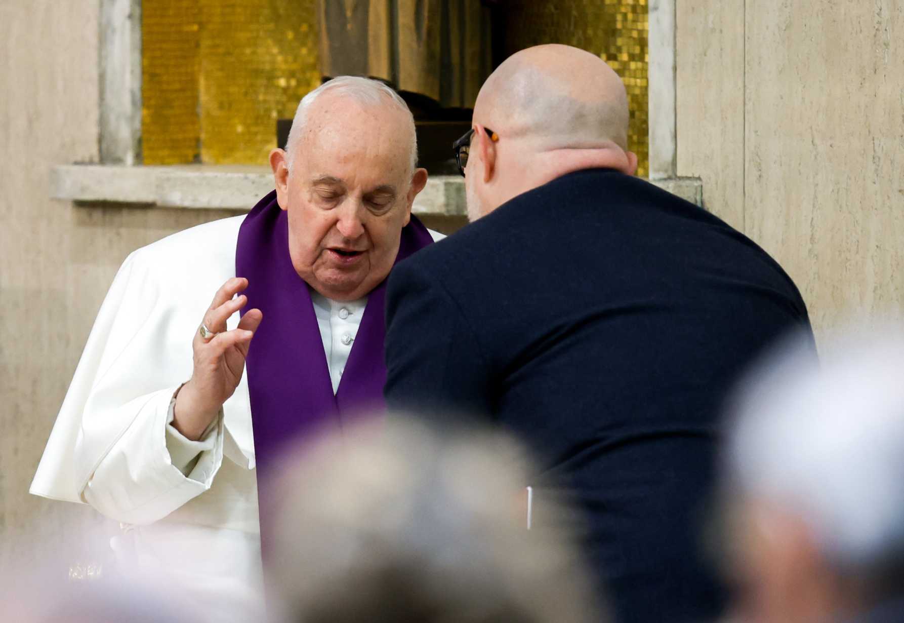 Pope Francis hears a man's confession during a Lenten penance service March 8, 2024, at the parish of St. Pius V in Rome. (Credit: Lola Gomez/CNS.)