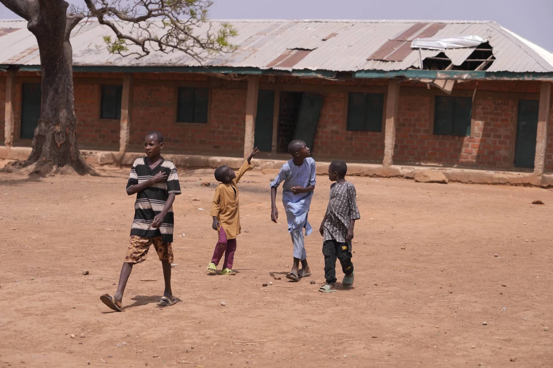 Children walk past classrooms at the LEA Primary and Secondary School Kuriga where students were kidnapped in Kuriga, Kaduna, Nigeria, Saturday, March 9, 2024. (Credit: Sunday Alamba/AP.)