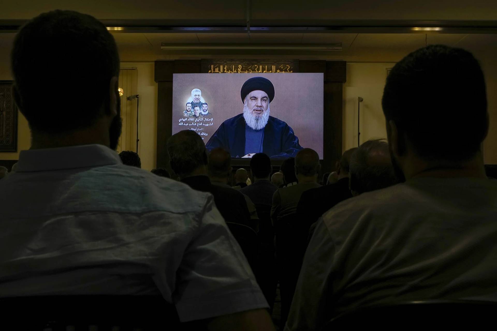 Hezbollah supporters watch a speech by Hezbollah leader Sayyed Hassan Nasrallah, on June 19, 2024. (Credit: Bilah Hussein/AP.)