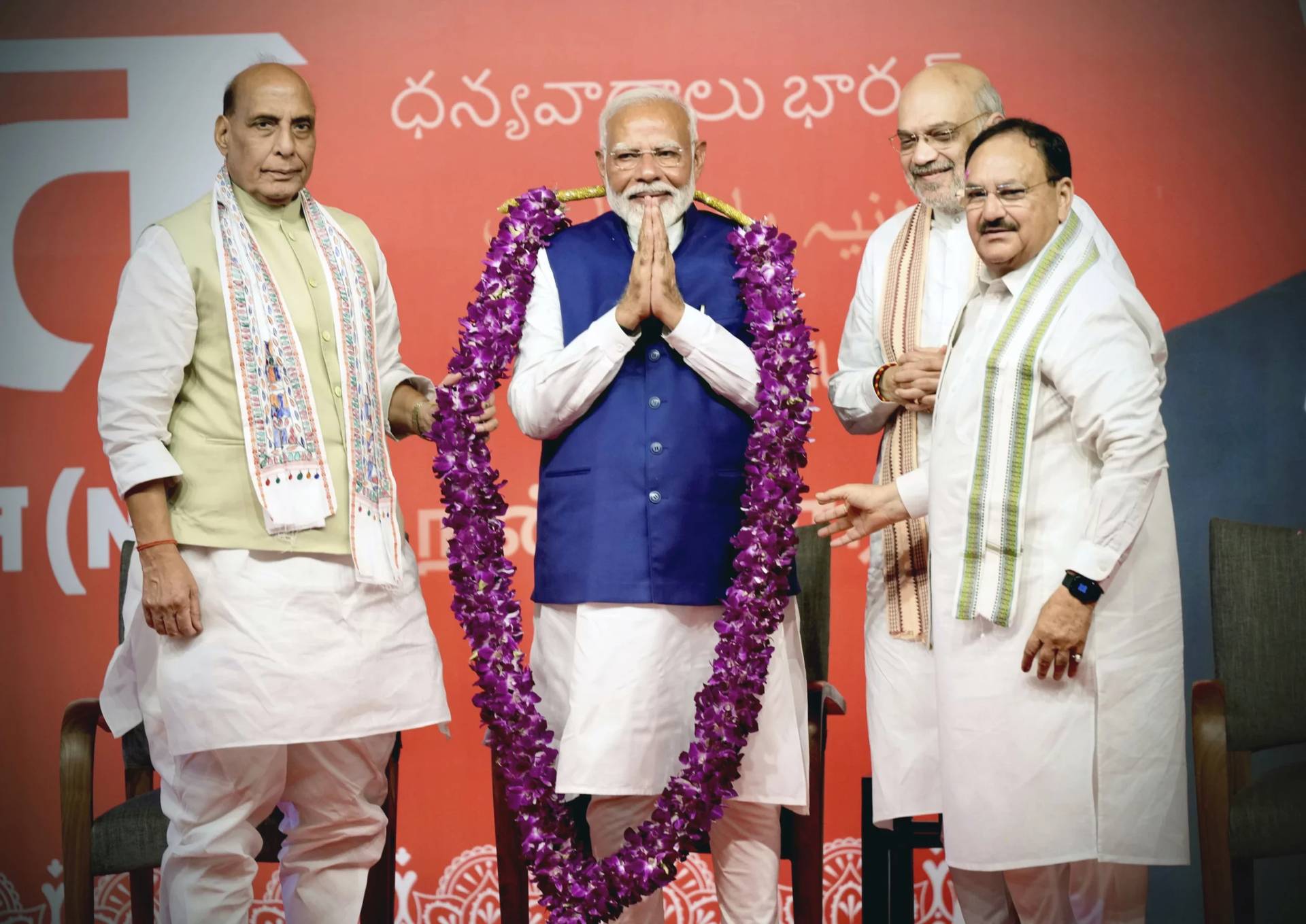 Prime Minister Narendra Modi is garlanded by senior Bharatiya Janata Party (BJP) leaders Rajnath Singh, left, party President JP Nadda, right, and Amit Shah, at the party headquarters in New Delhi, India, Tuesday, June 4, 2024. (Credit: Manish Swarup/AP.)