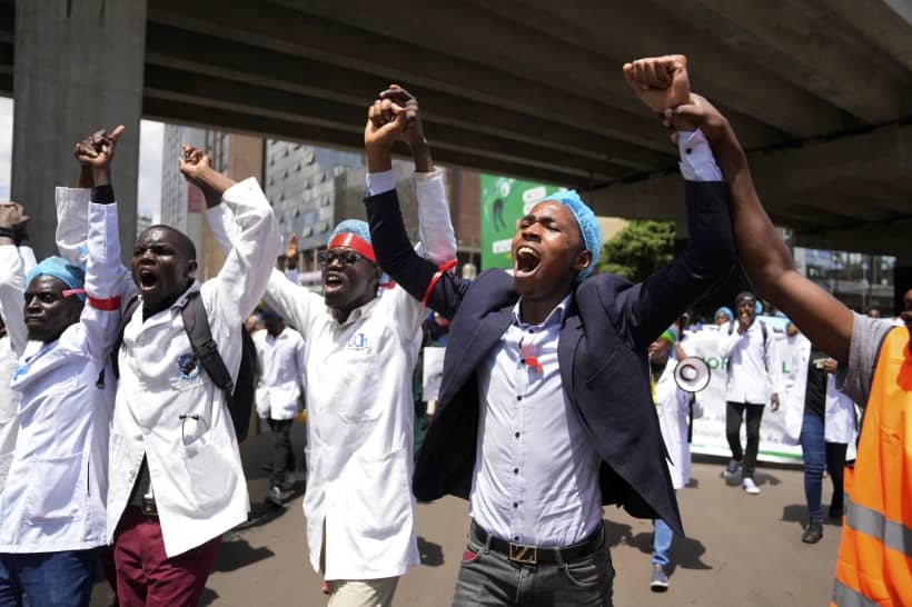 Doctors and other medical staff take part in a protest, in downtown Nairobi, Kenya, Tuesday, April 16, 2024. Kenya’s public hospital doctors union on Wednesday, May 8, 2024, signed a return to work agreement with the government, ending a national strike that began in mid-March and had left patients in limbo. (Credit: Brian Inganga/AP.)