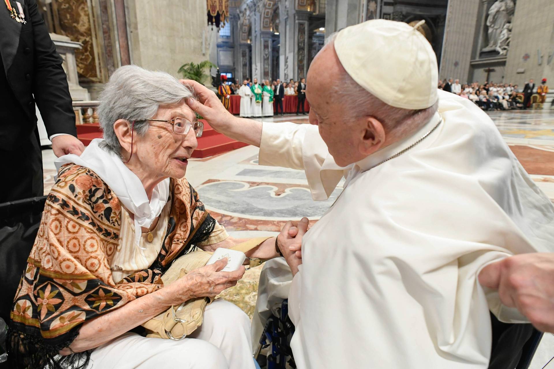 Pope Francis greets 100-year-old Lucilla Macelli before celebrating Mass in St. Peter’s Basilica at the Vatican, marking World Day for Grandparents and the Elderly on July 23, 2023. (Credit: Vatican Media.)