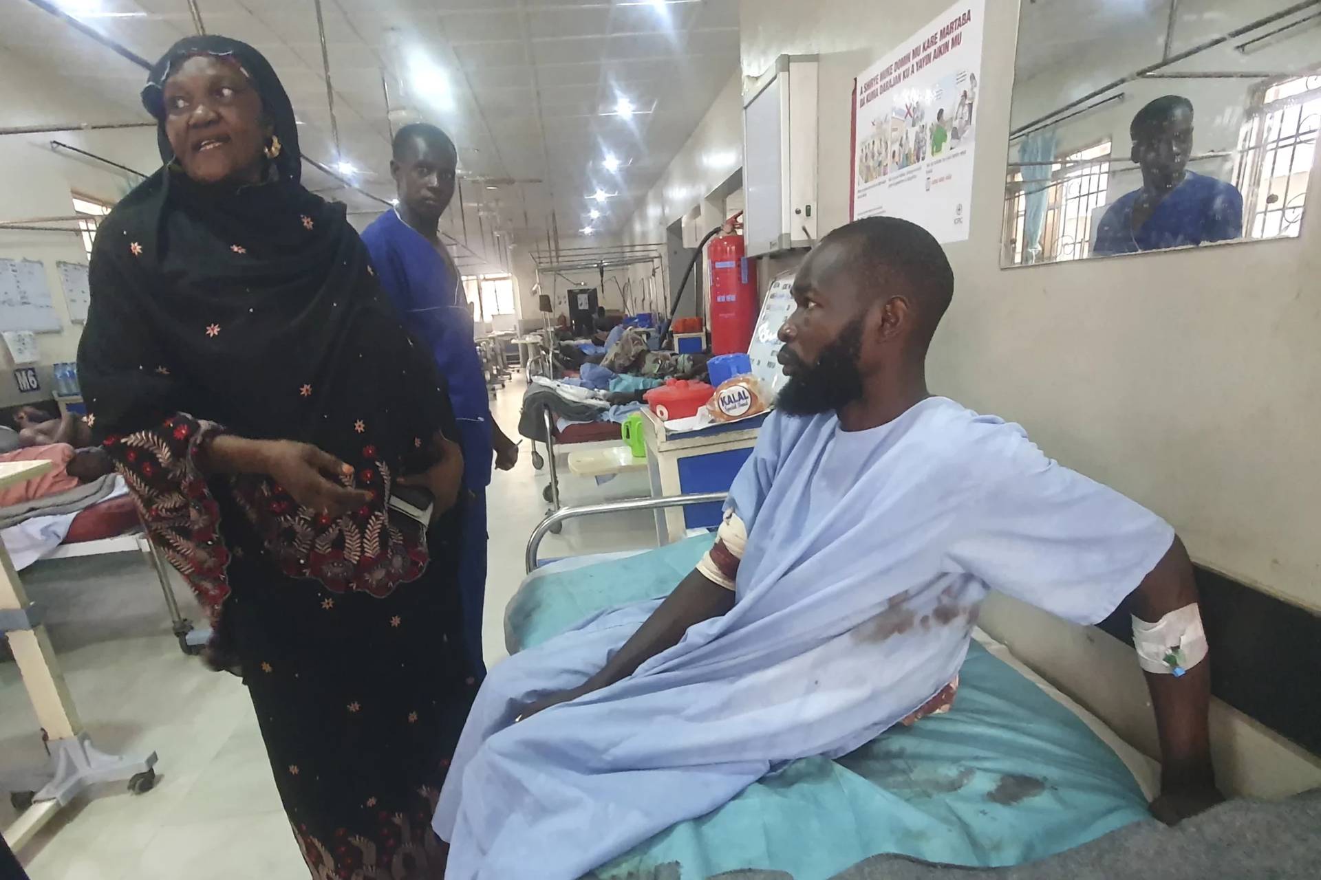 An injured victim of a suicide bomb attack receives treatment at a hospital in Maiduguri, Nigeria, Sunday, June 30, 2024. At least 18 people were killed and 30 injured, including 19 seriously, in coordinated attacks by suspected female suicide bombers in Nigeria’s northeastern city of Gwoza on Saturday, local authorities said, raising security concerns in a region which has been at a center of Islamist insurgency. (Credit: Joshua Omiri/AP.)