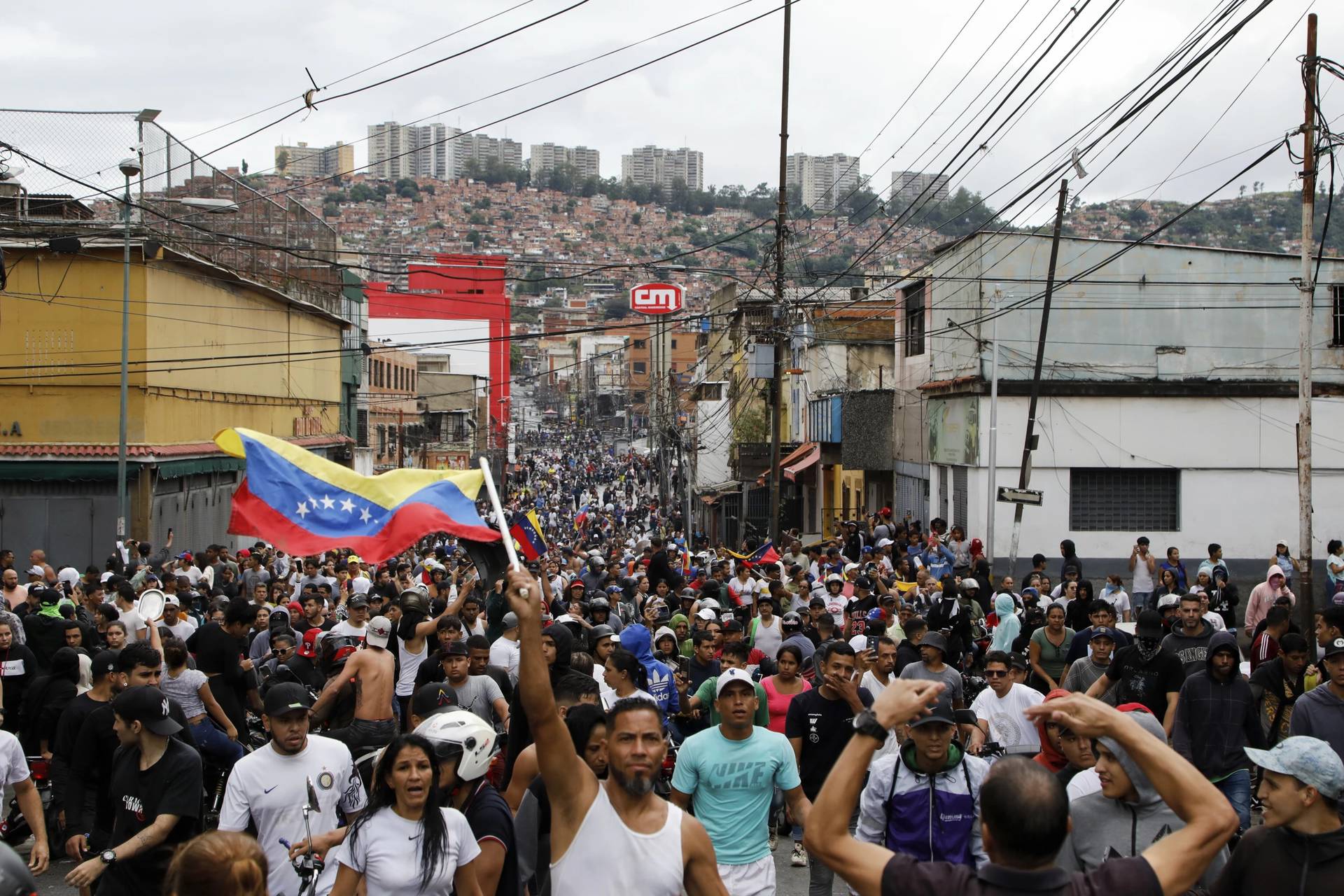 Protesters demonstrate against the official election results declaring President Nicolas Maduro won reelection in the Catia neighborhood of Caracas, Venezuela, Monday, July 29, 2024, the day after the vote. (Credit: Cristian Hernandez/AP.)