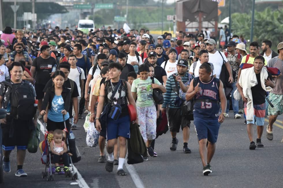 Migrants walk along the highway through Suchiate, Chiapas state in southern Mexico, Sunday, July 21, 2024, during their journey north toward the U.S. border. (Credit: Edgar H. Clemente/AP.)