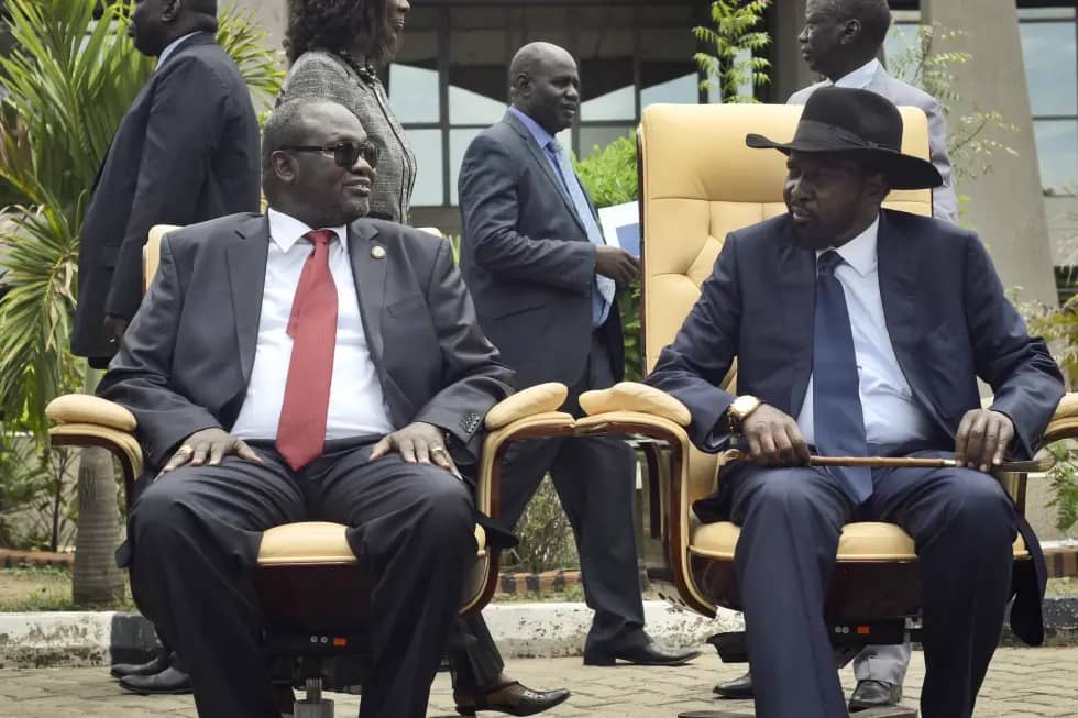 South Sudan’s then First Vice President Riek Machar, left, looks across at President Salva Kiir, right, as they sit to be photographed following the first meeting of a transitional coalition government, in the capital Juba, South Sudan on April 29, 2016. (Credit: Jason Patinkin/AP.)
