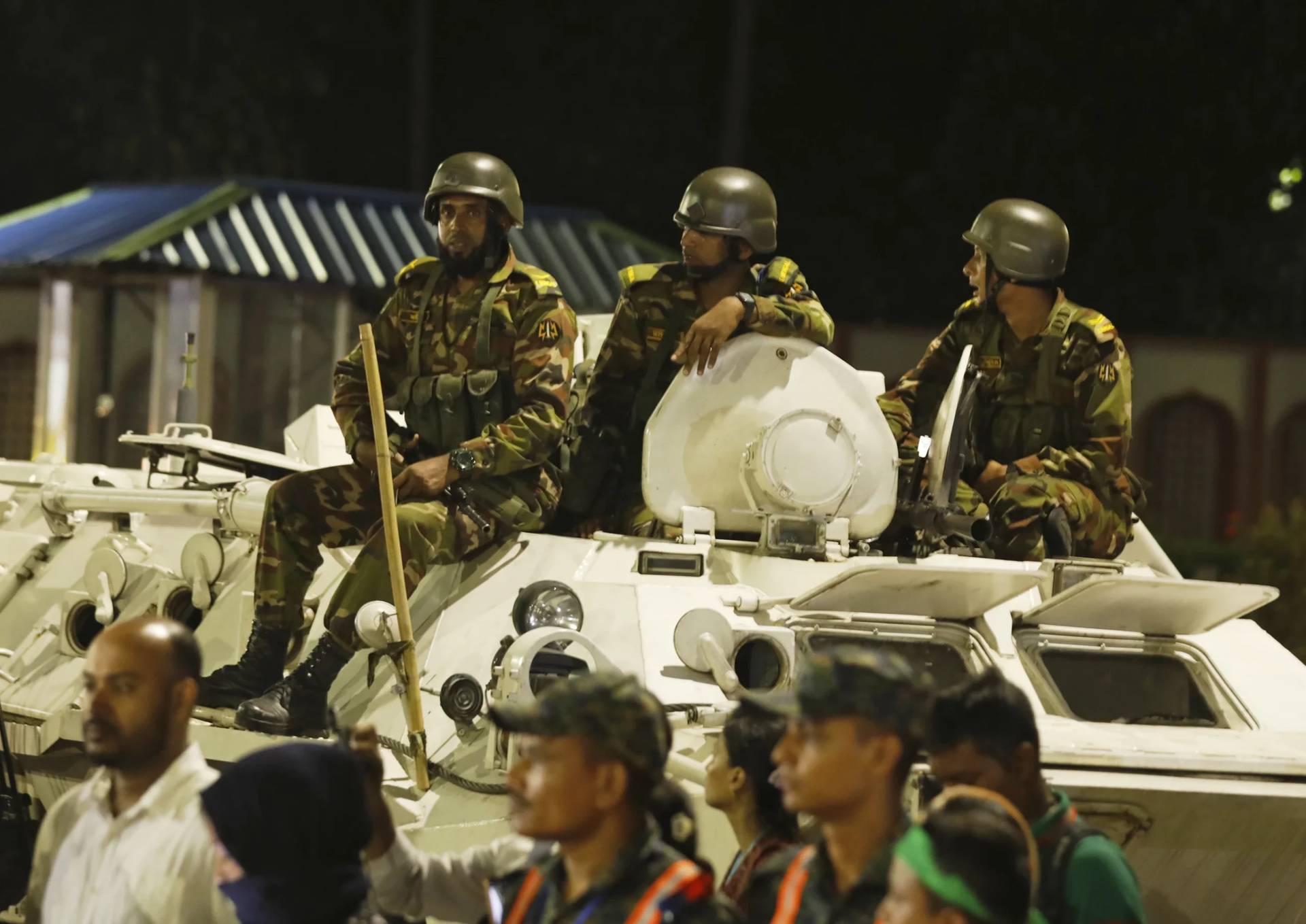 Army soldiers keep guard in front of the President’s official residence during the oath taking ceremony of the interim government in Dhaka, Bangladesh, Thursday, Aug. 8, 2024. (Credit: Rajib Dhar/AP.)