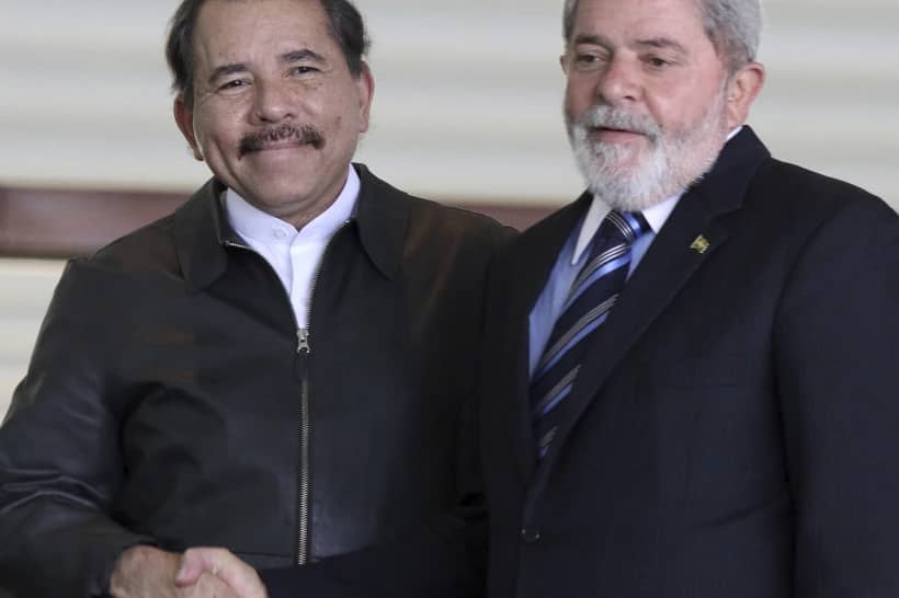 Nicaragua’s President Daniel Ortega, left, shakes hands with Brazil’s President Luiz Inacio Lula da Silva at Itamaraty palace in Brasilia, Brazil July 28, 2010. (Credit: Eraldo Peres/AP.)