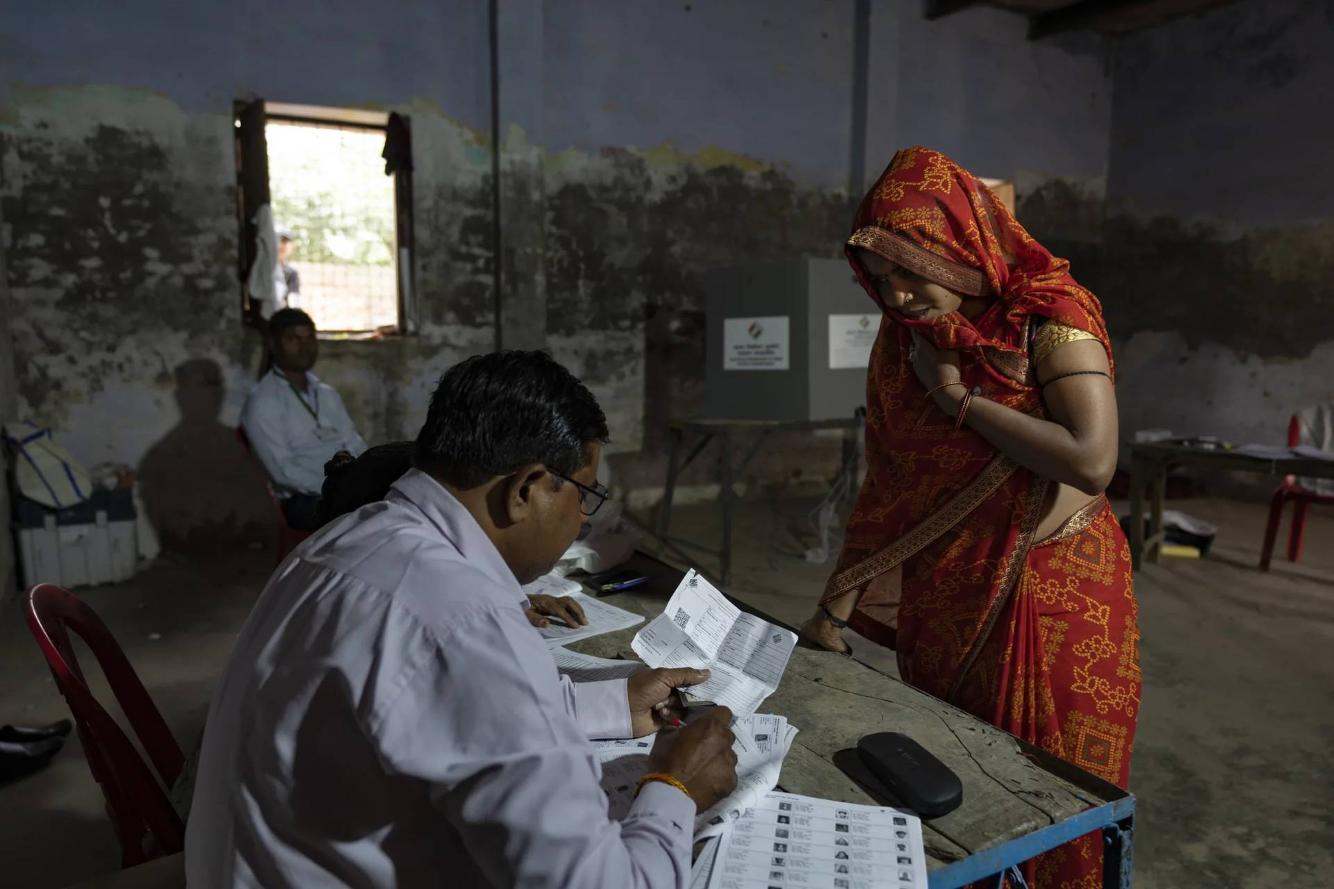 A woman arrives to cast her vote in Agra, Uttar Pradesh in India on May 7, 2024. (Credit: Altaf Qadri/AP.)