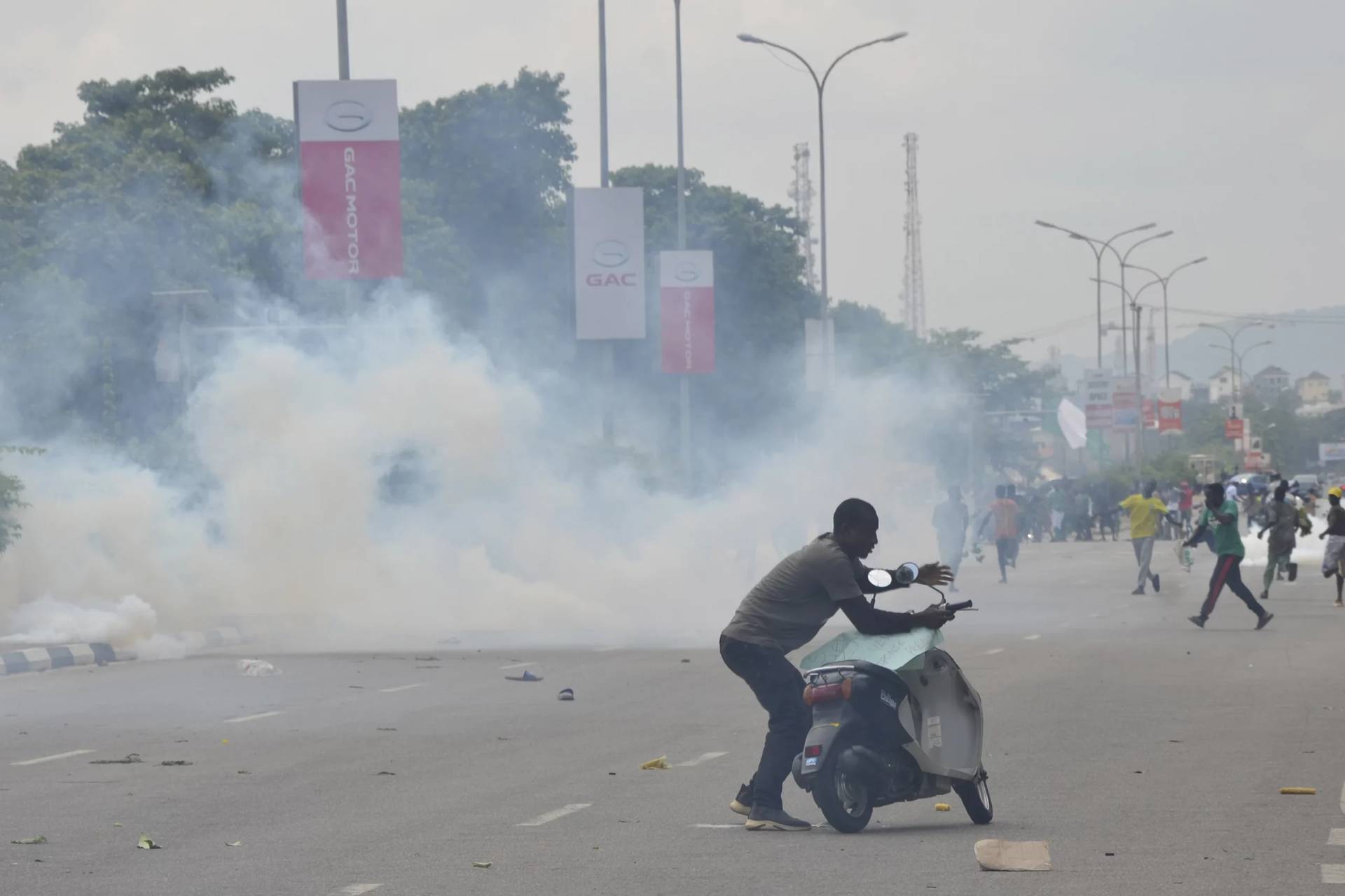 Police fired tear gas during a protest in Abuja, Nigeria, Thursday, Aug. 1, 2024. Nigeria’s leader on Sunday, Aug. 4, called for an end to mass protests against the West African nation’s economic hardship, saying the rallies have turned violent and have become politically motivated. (Credit: Olamikan Gbemiga/AP.)