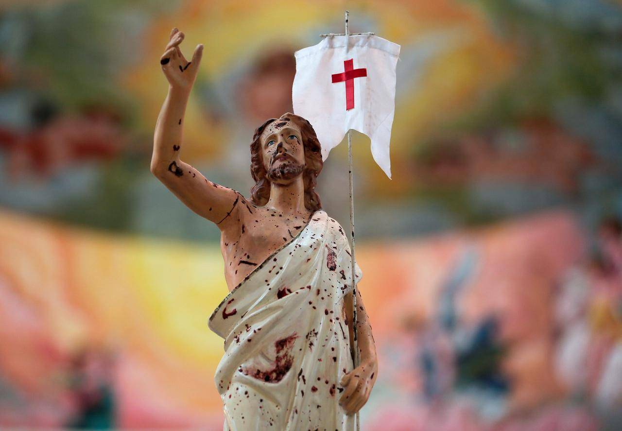 A statue of Christ splattered with blood from the 2019 Easter bomb attack at St. Sebastian’s Church in Negombo, Sri Lanka, is pictured during Easter Mass at the church April 4, 2021. (Credit: Dinuka Liyanawatte/Reuters via CNS.)