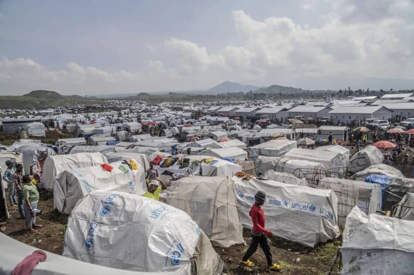 People displaced by the ongoing fighting between Congolese forces and M23 rebels gather in a camp on the outskirts of Goma, Democratic Republic of Congo, March 13, 2024. (Credit: Moses Sawasawa/AP.)