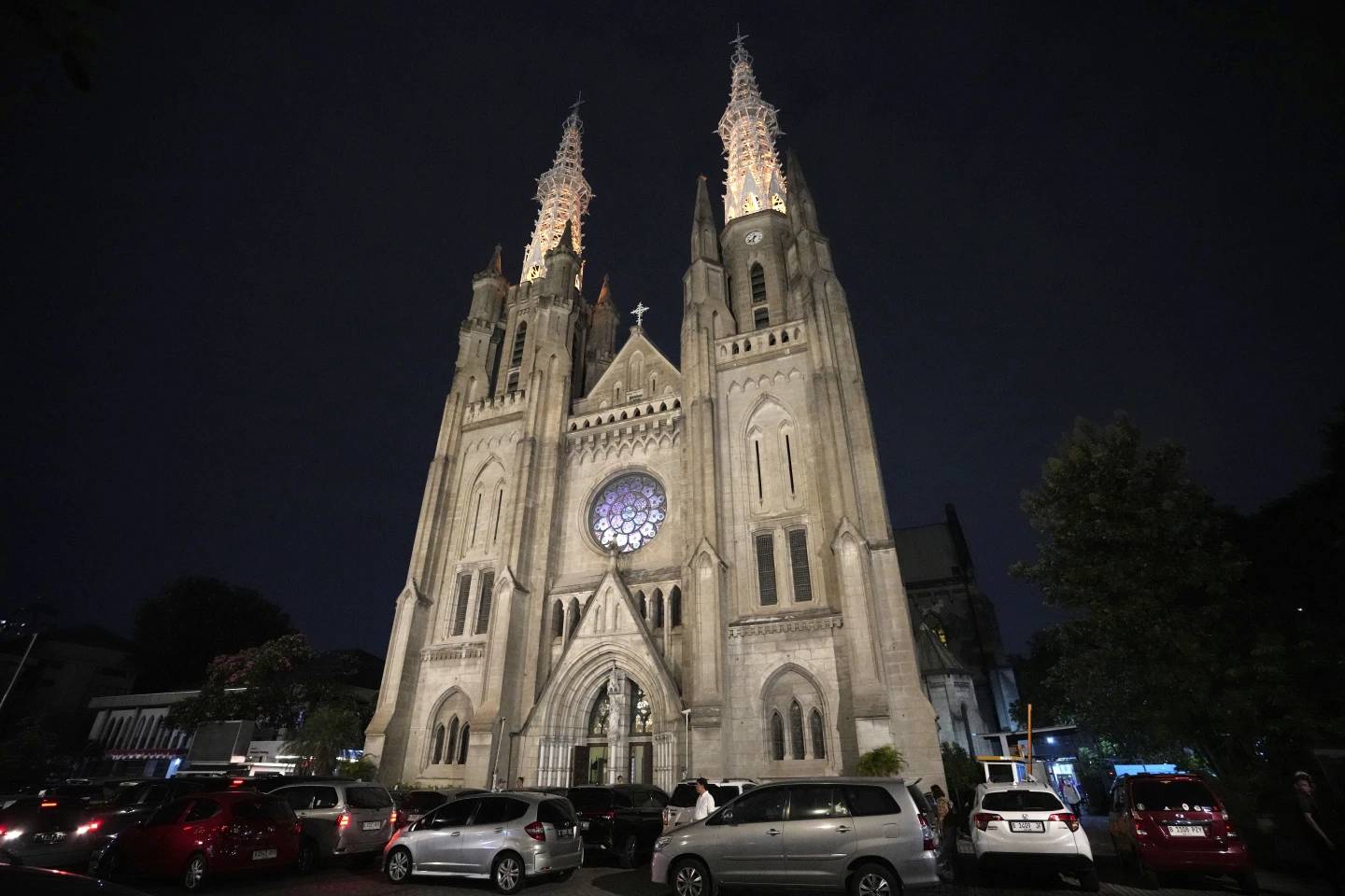 The Church of Our Lady of the Assumption, popularly known as the Jakarta Cathedral is illuminated during dusk in Jakarta, Indonesia, Aug. 8, 2024. (Credit: Achmad Ibrahim/AP.)