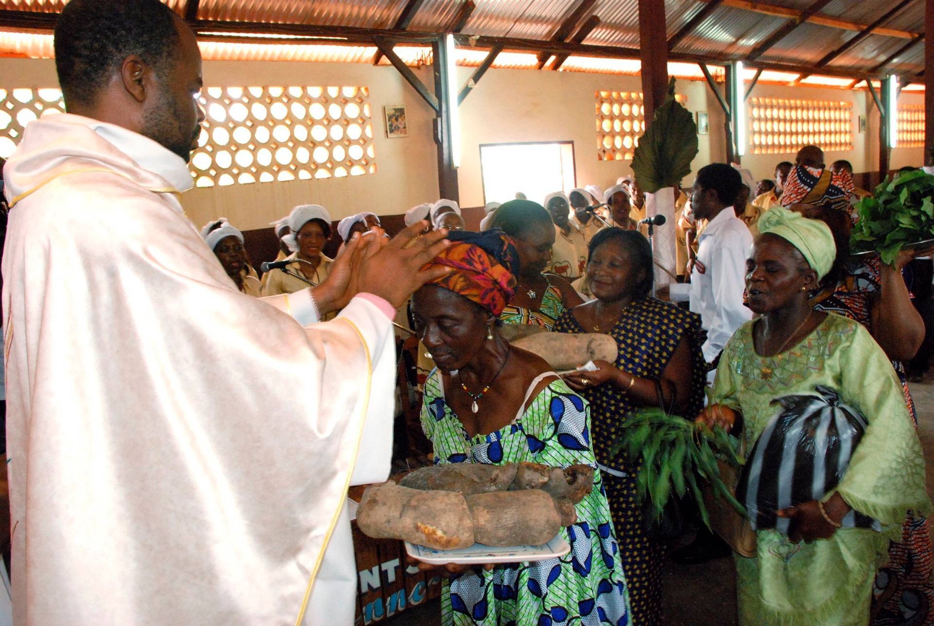 A priest is pictured in a file photo accepting offertory gifts during Mass at St. Therese of the Child Jesus Catholic Church in Yaounde, Cameroon. (Credit: Saabi/Galbe.Com via CNS.)