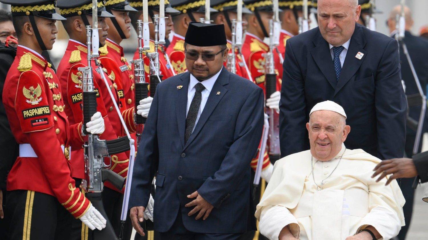 Pope Francis is greeted by Indonesia's Religious Affairs Minister Yaqut Cholil Qoumas after his arrival in Jakarta on Sept. 3, 2024. (Credit: Vatican Media.)