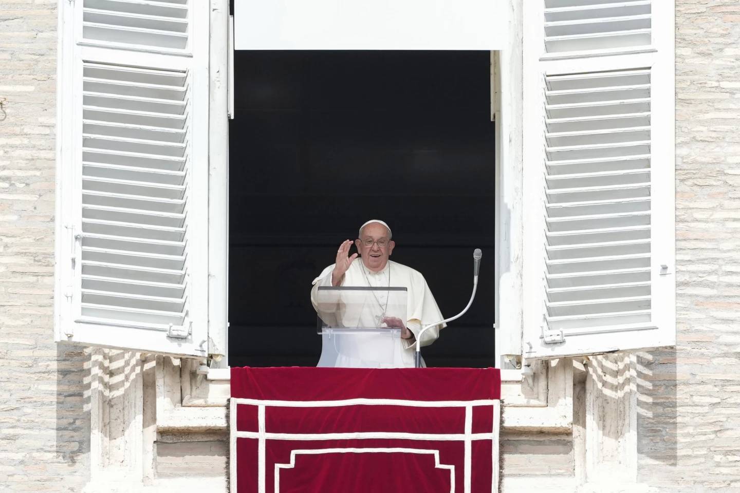 Pope Francis waves during the Angelus noon prayer from the window of his studio overlooking St. Peter's Square at the Vatican, Sunday, Sept. 22, 2024. (Credit: Alessandra Tarantino/AP.)