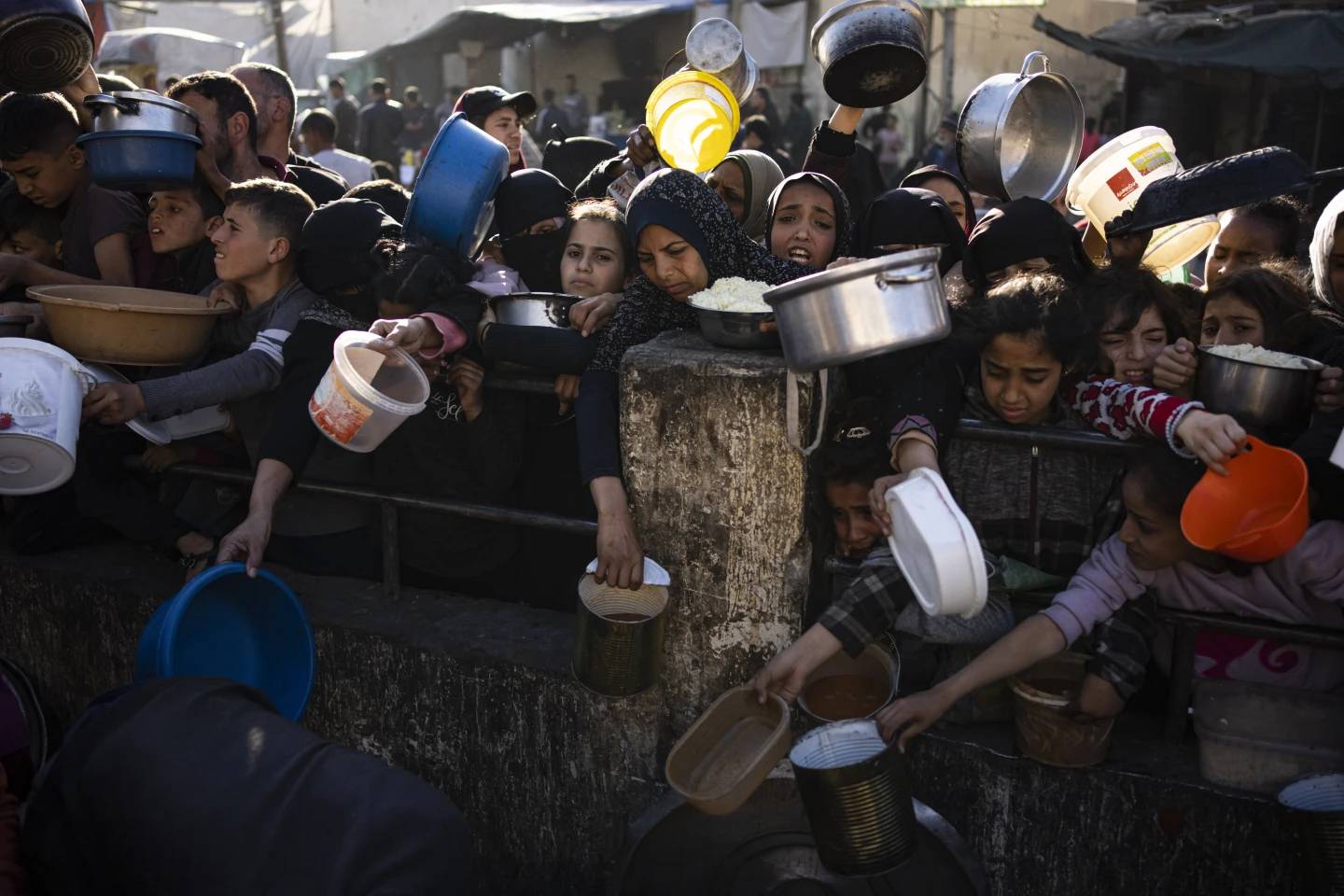 Palestinians line up for a free meal in Rafah, Gaza Strip, on March 12, 2024. (Credit: Fatima Shbair/AP.)