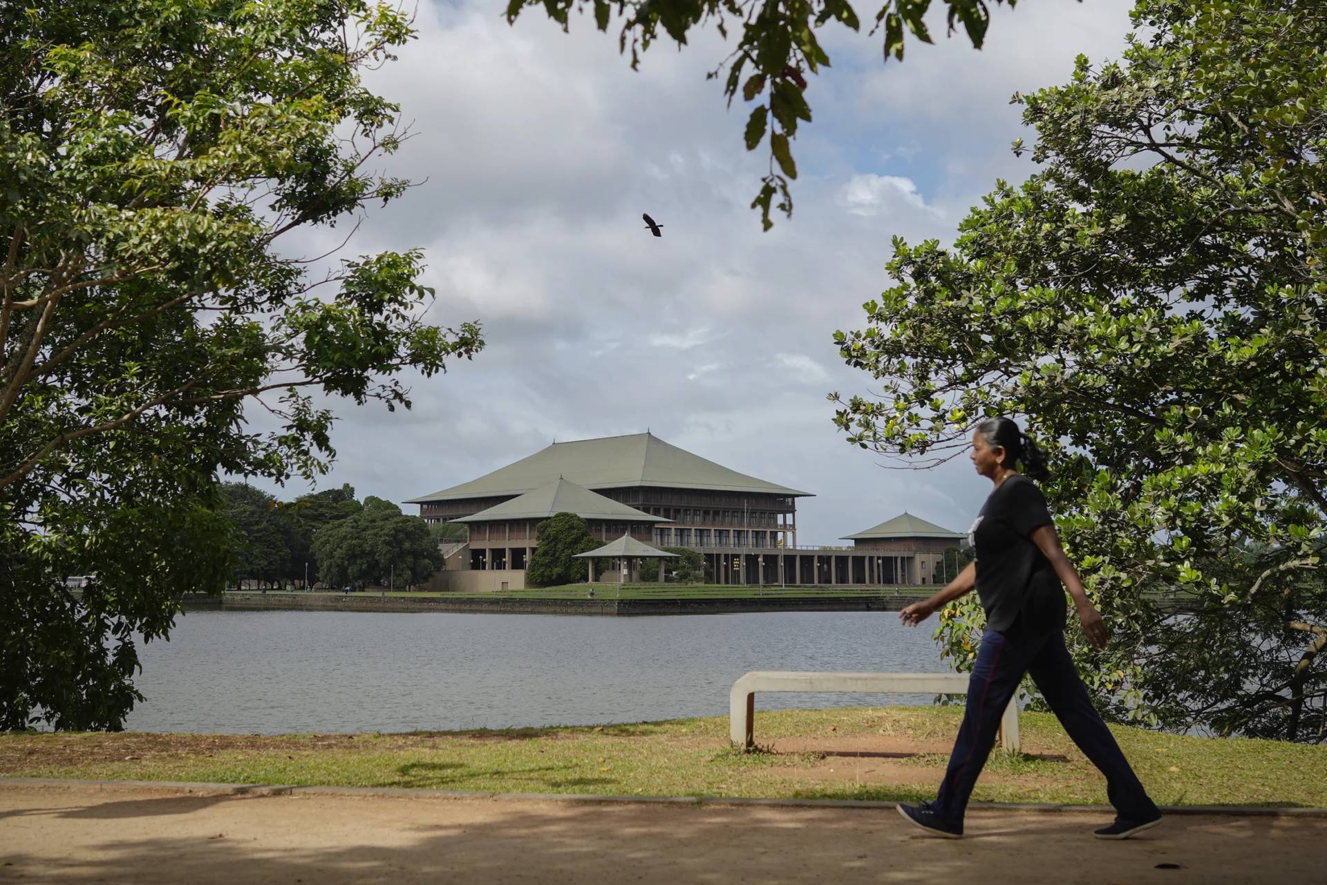 A woman walks outside the parliamentary complex in Colombo, Sri Lanka, Wednesday, Sept. 25, 2024. (Credit: Eranga Jayawardena/AP.)