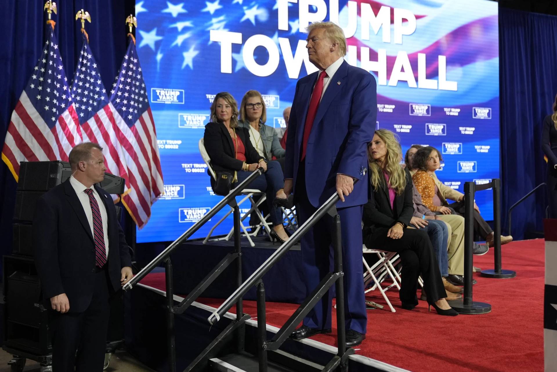 Republican presidential nominee former President Donald Trump checks on a person having a medical emergency at a campaign town hall at the Greater Philadelphia Expo Center & Fairgrounds, Monday, Oct. 14, 2024, in Oaks, Pa. (Credit: Alex Brandon/AP.)