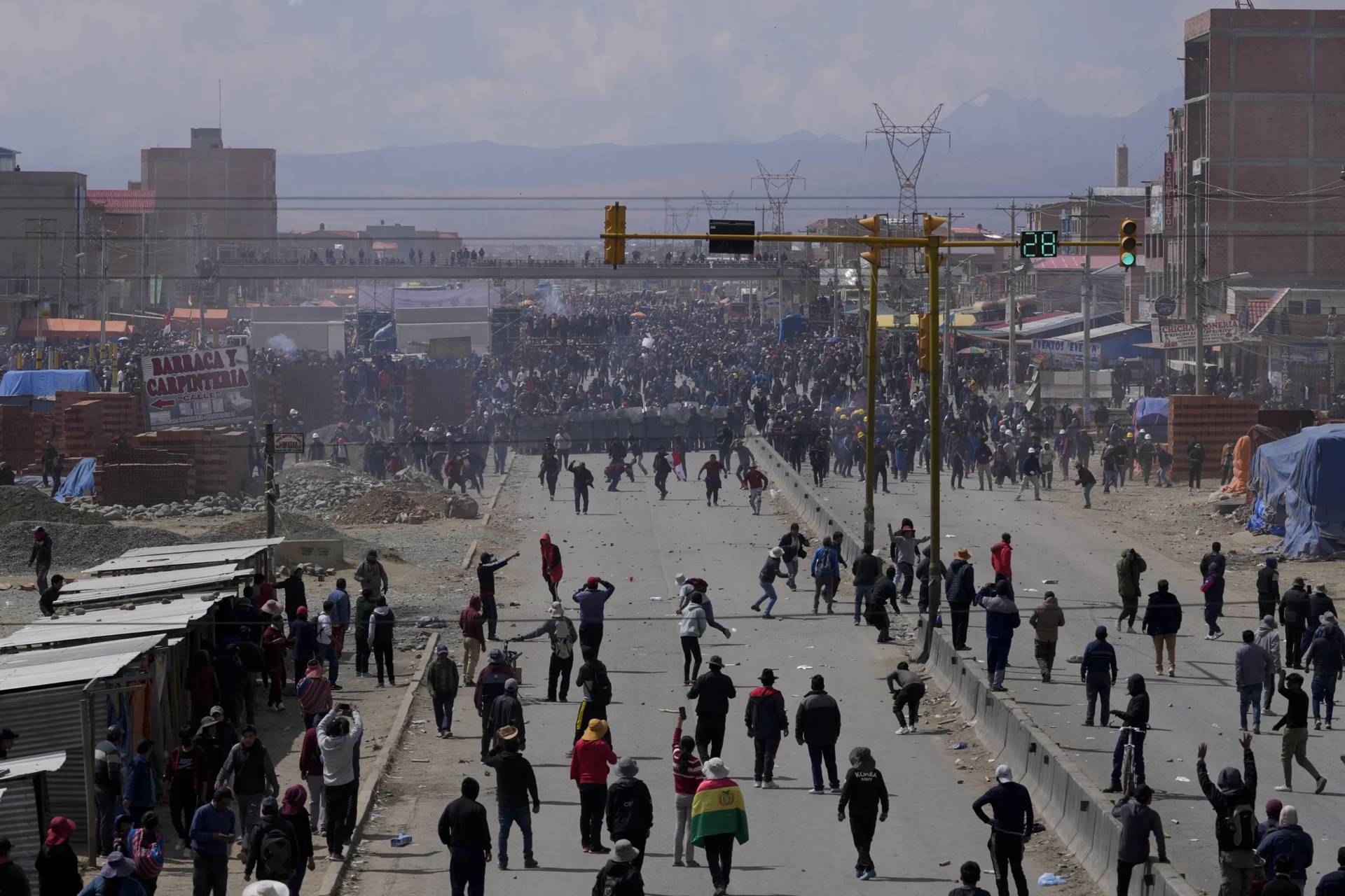 Supporters of former President Evo Morales, below, face off with supporters current President Luis Arce in El Alto, Bolivia, Sunday, Sept. 22, 2024. (Credit: Juan Karita/AP.)