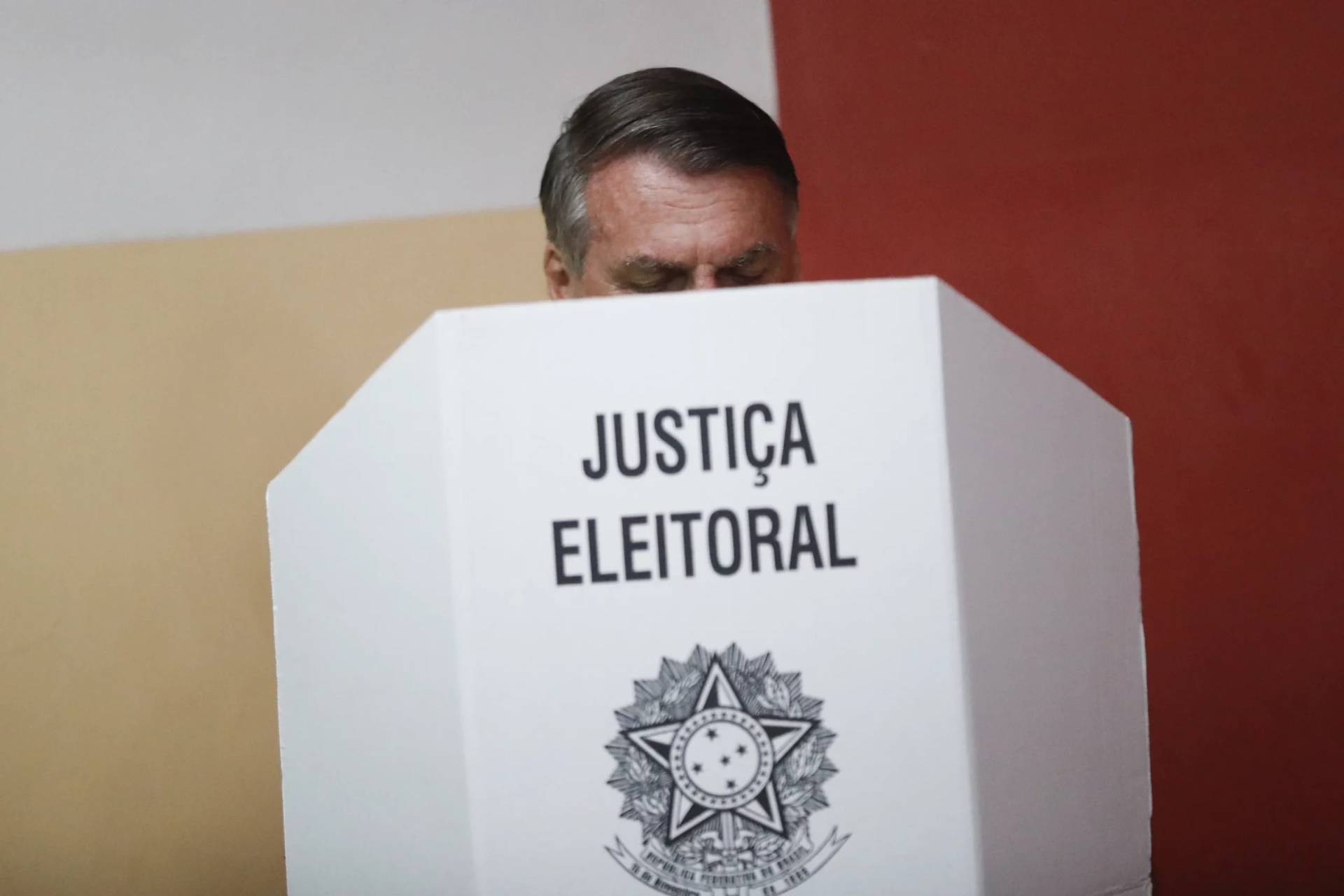 Brazilian President Jair Bolsonaro votes in the run-off presidential election as he runs for another term in Rio de Janeiro, Brazil, Oct. 30, 2022. (Credit: Bruna Prado, Pool via AP.)