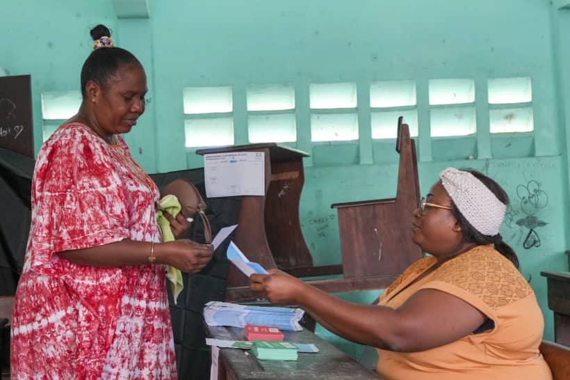 A woman votes in a referendum on whether to adopt a new constitution, in Libreville, Gabon, Saturday, Nov. 16, 2024. (Credit: Betines Makosso/AP.)