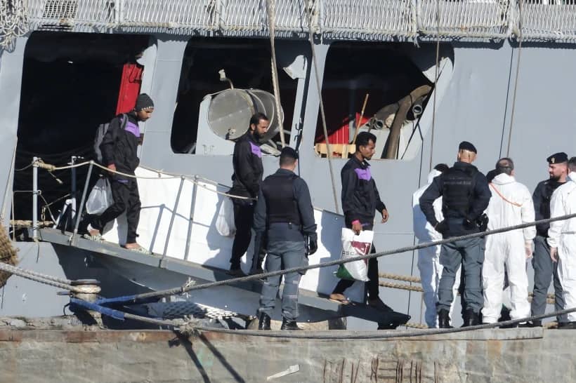 Migrants disembark from the Italian navy ship Libra at the port of Shengjin, northwestern Albania, Friday, Nov. 8, 2024, as a second group of eight migrants intercepted in international waters is processed in a reception facility despite the failure with the first group in October.(Credit: Vlasov Sulaj/AP.)