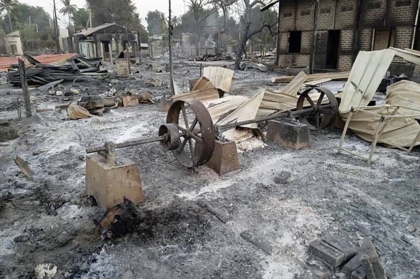 Charred homes sit in piles of ash in Mwe Tone village of Pale township in the Sagaing region, Myanmar, Feb. 1, 2022. (Credit: AP Photo.)