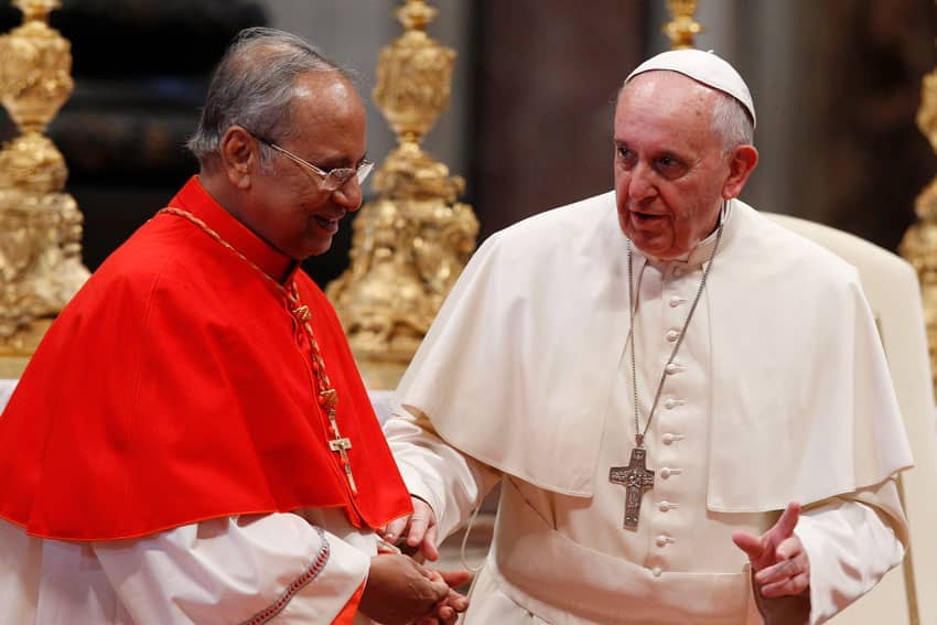 Pope Francis talks with Cardinal Malcolm Ranjith of Colombo, Sri Lanka, during an audience with pilgrims from Sri Lanka after a Mass in St. Peter’s Basilica at the Vatican Feb. 8, 2014. (Credit: Paul Haring/CNS.)