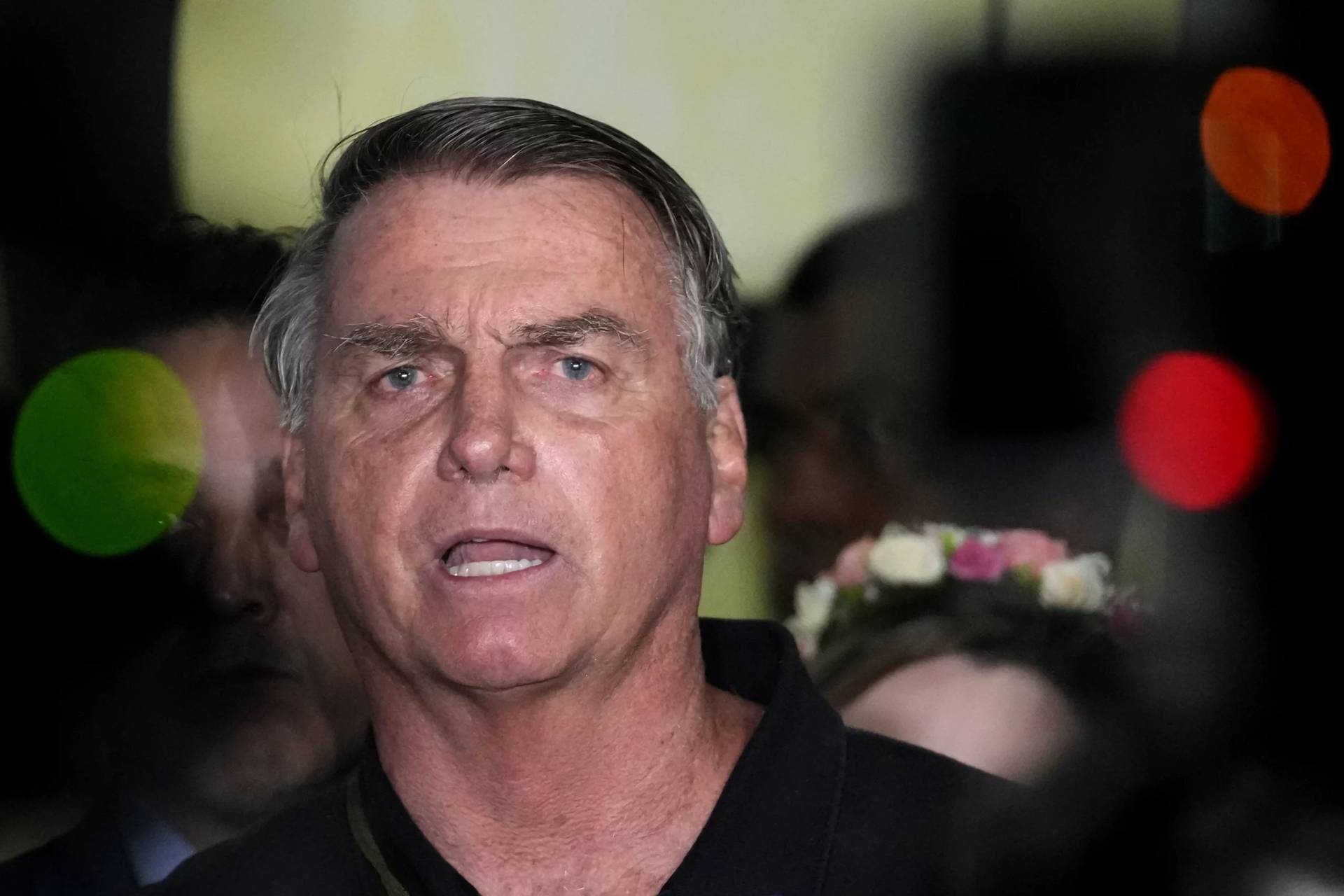 Former President Jair Bolsonaro speaks to the press after being formally charged by the federal police with attempted coup, at the airport in Brasilia, Brazil, Monday, Nov. 25, 2024. (Credit: Eraldo Peres/AP.)