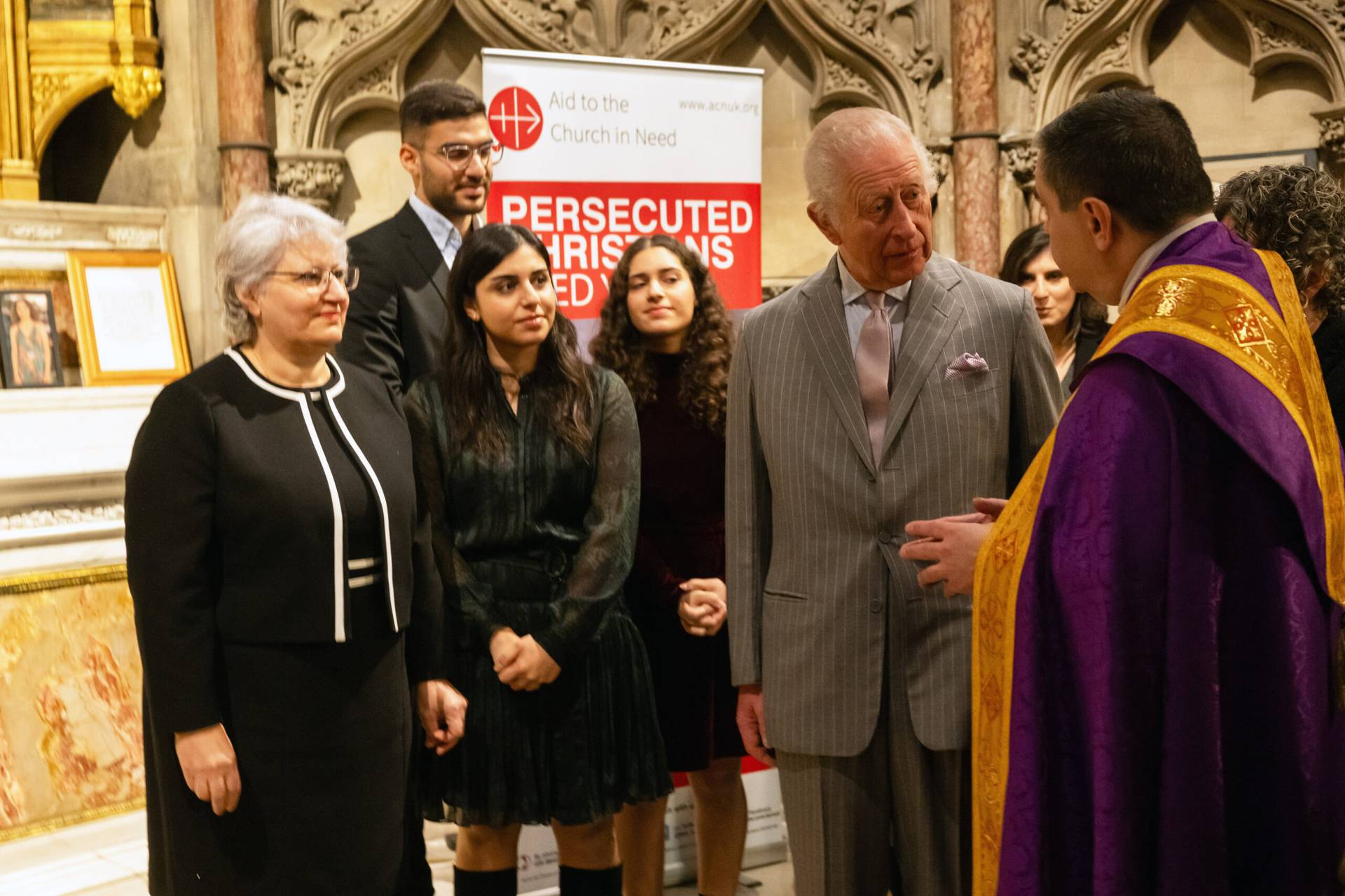 King Charles III meets with people at the Catholic Church of The Immaculate Conception in London, England, Dec. 17, 2024.)