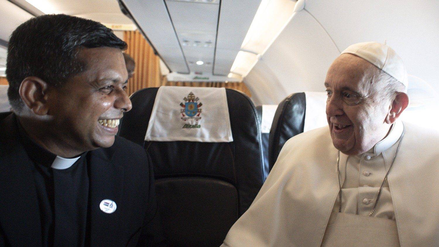 Pope Francis with now-Cardinal George Jakob Koovakad aboard the papal plane in 2021. (Credit: Vatican Media.)