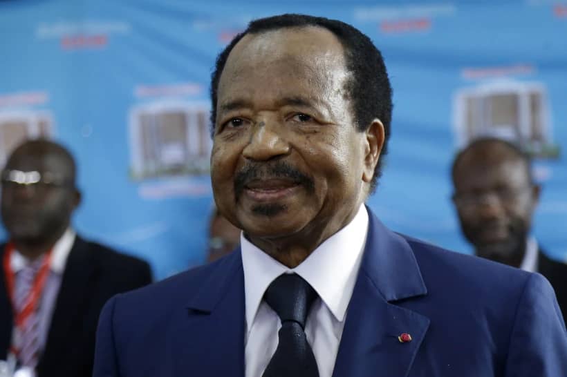 In this Oct. 7, 2018 file photo, Cameroon’s President Paul Biya, of the Cameroon People’s Democratic Movement party, wait to casts his vote during the Presidential elections in Yaounde, Cameroon. (Credit: Sunday Alamba/AP.)