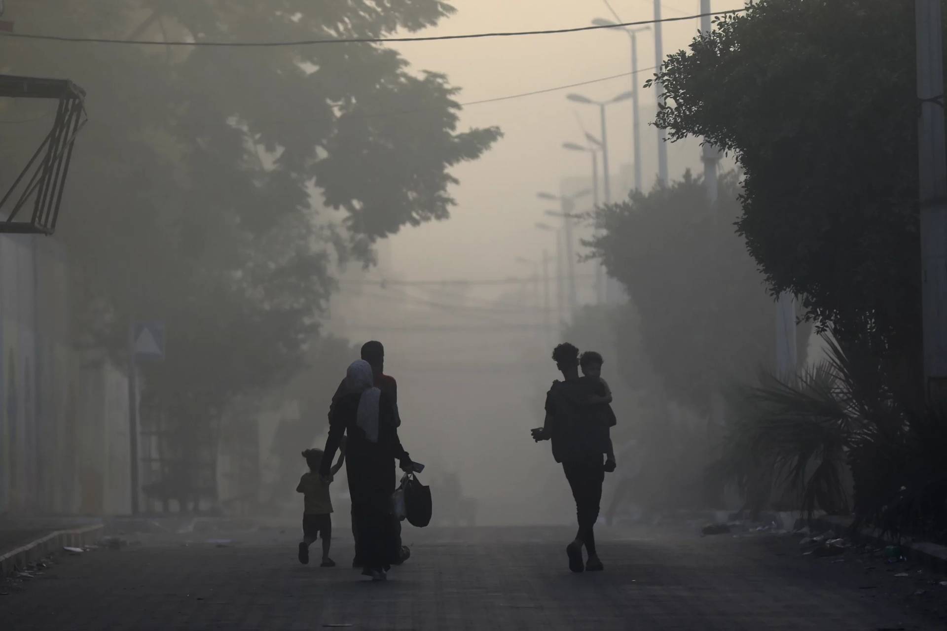 Palestinians flee their neighborhood in Gaza on Nov. 8, 2023. (Credit: Associated Press.)