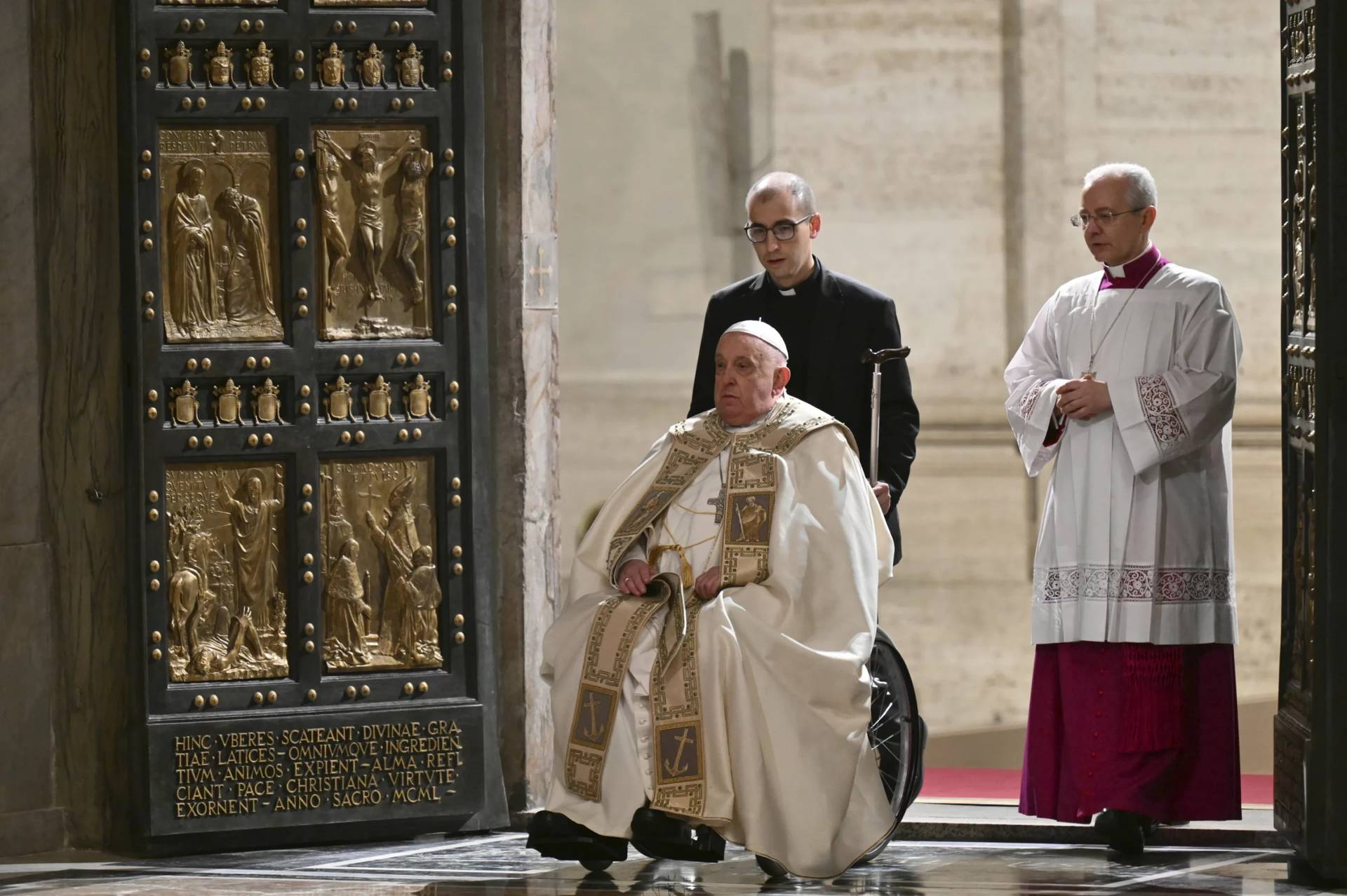 Pope Francis goes through the Holy Door at St. Peter’s Basilica at the Vatican on Dec. 24, 2024. (Credit: Alberto Pizzoli/AP.)