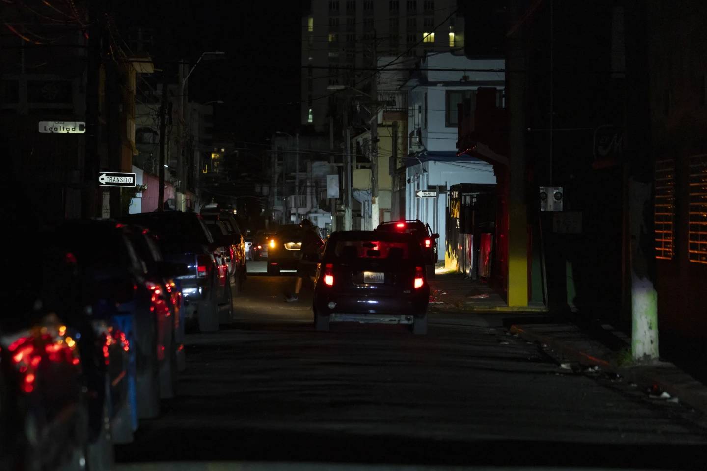 A street is dark during a blackout in San Juan, Puerto Rico, after sunset on Tuesday, Dec. 31, 2024 (Credit: Alejandro Granadillo/AP.)