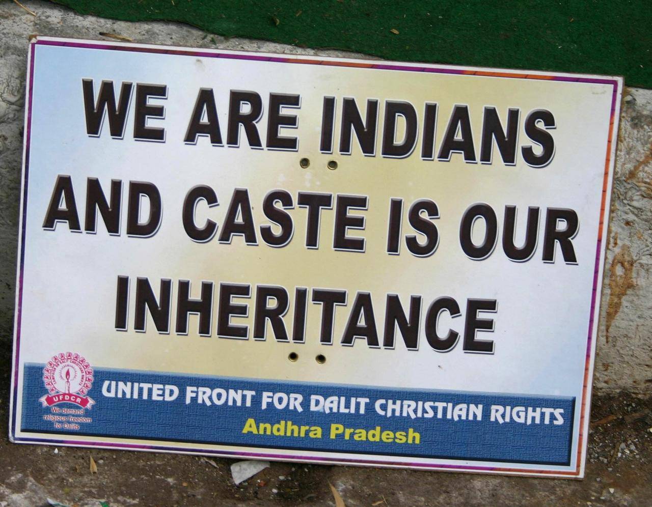 A sign at a Dec. 8, 2006, hunger sit-in by Christian Dalits in New Delhi, India, displays the deep roots of the caste system in India. Dalits are low castes who perform menial jobs and are treated as untouchables. (Credit: Anto Akkara/CNS.)