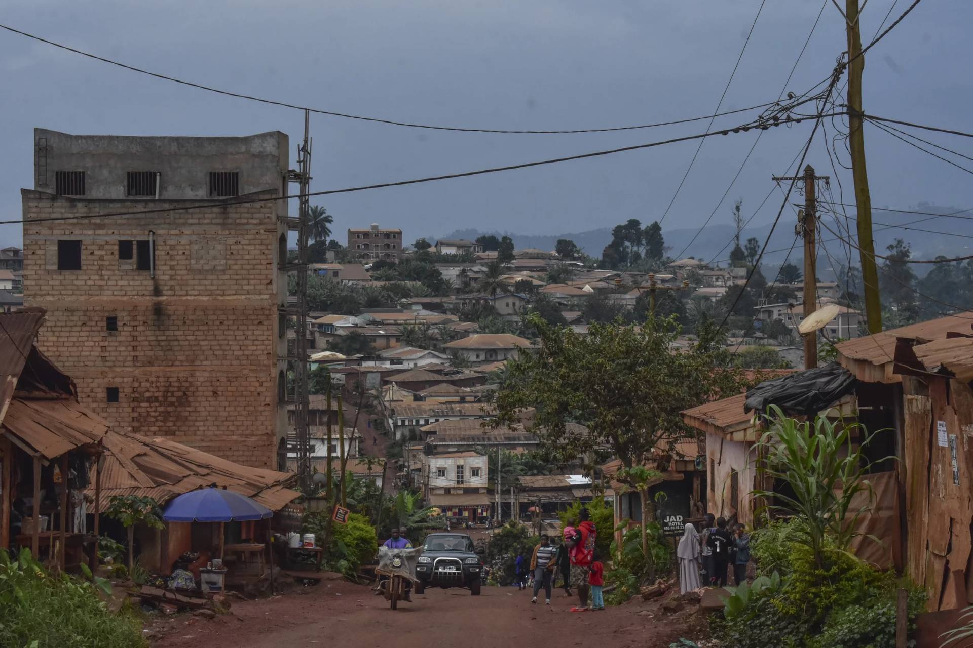 A view of a street where Ateasong Belts Tajoah teaches philosophy, helping to rebuild a community scarred by conflict, in Dschang, Cameroon, Dec. 1, 2024. (Credit: Robert Bociaga/AP.)