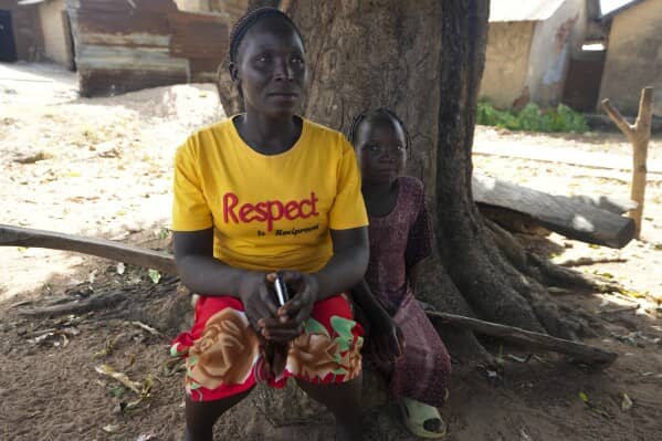 Abigail Samaniya, left, mother of Juliet Samaniya, right, 6, sit together in Paseli, Nigeria, Tuesday, Nov 5, 2024. (Credit: Sunday Alamba/AP.)