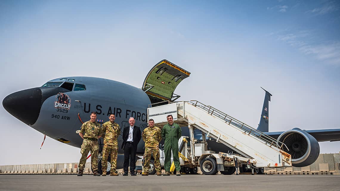 Bishop Paul Mason with British and U.S. military in Qatar. (Credit: Catholic Bishops' Conference of England and Wales.)