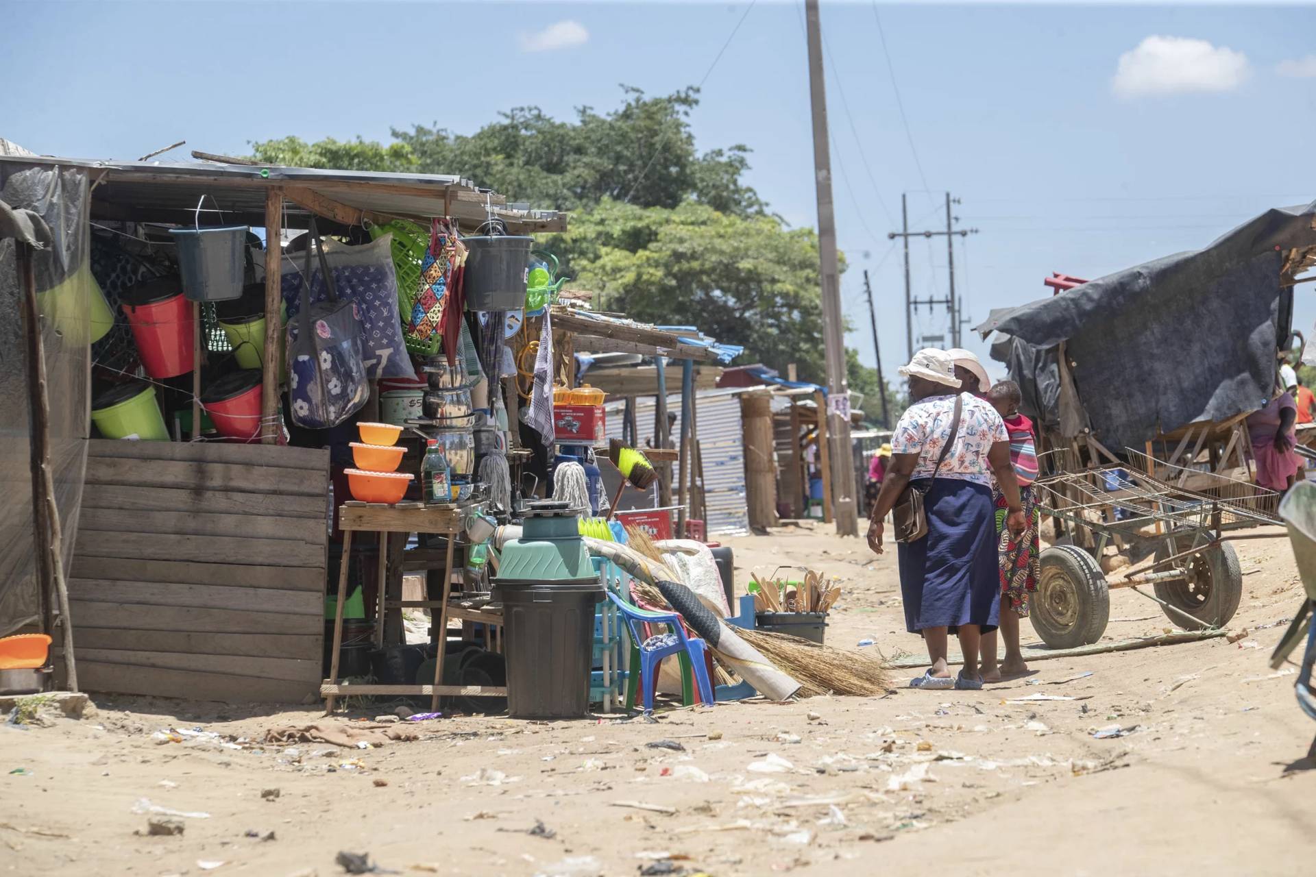 Women walk in a market in Harare, Zimbabwe, Friday, Feb. 7, 2025. (Credit: Aaron Ufumeli/AP.)